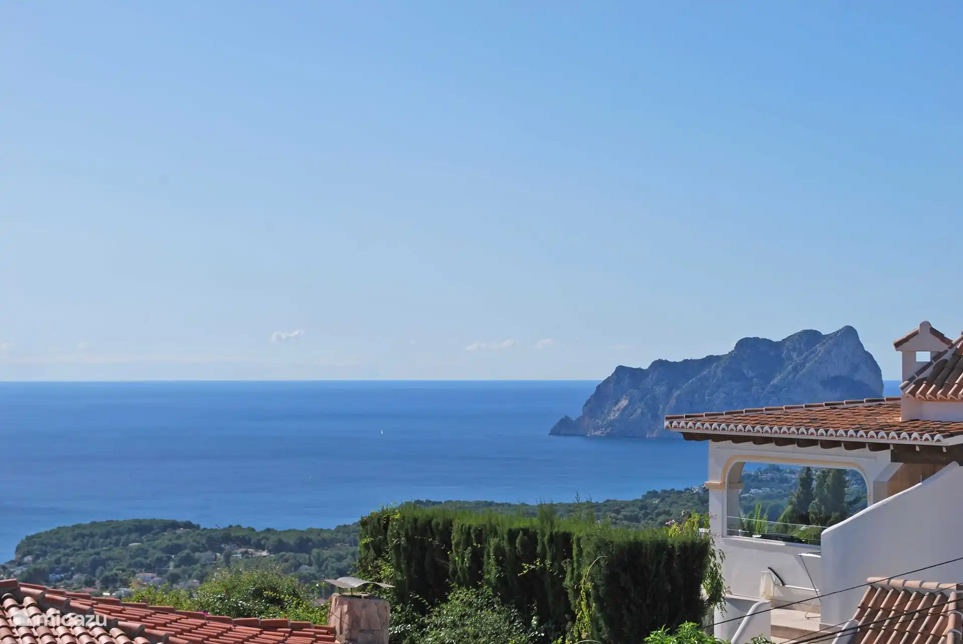 view from the sun terrace to the famous Ifach rock of Calpe