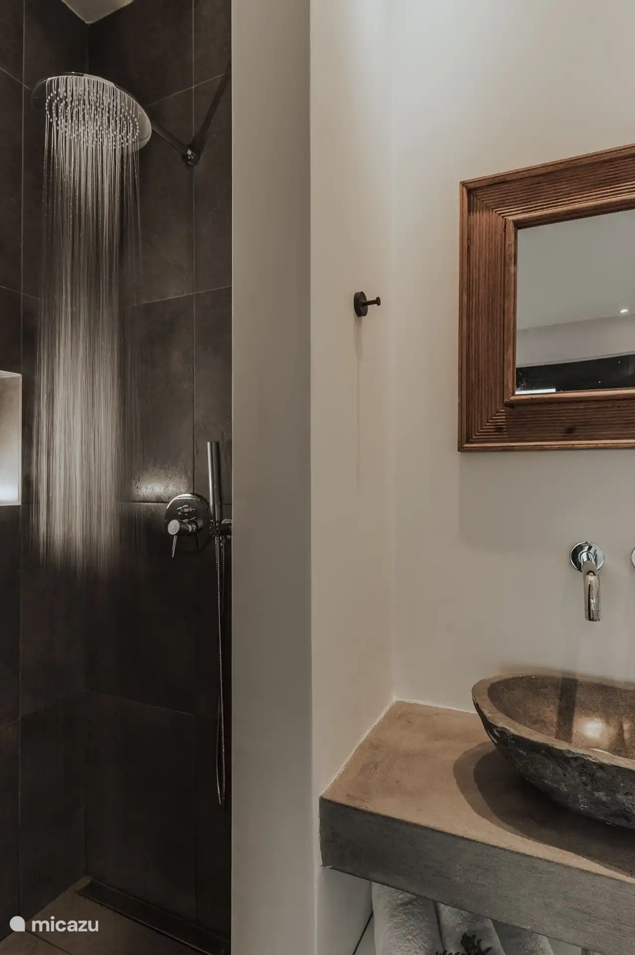 Rainshower, stone wash basin and mirror