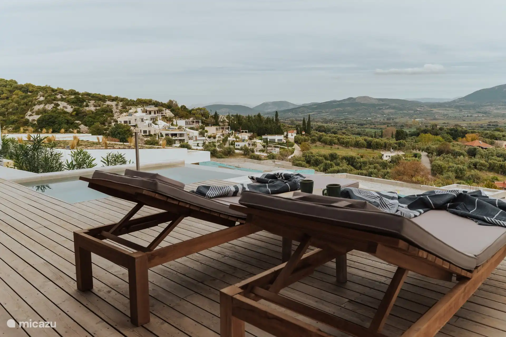 Terrace with sunbeds and view