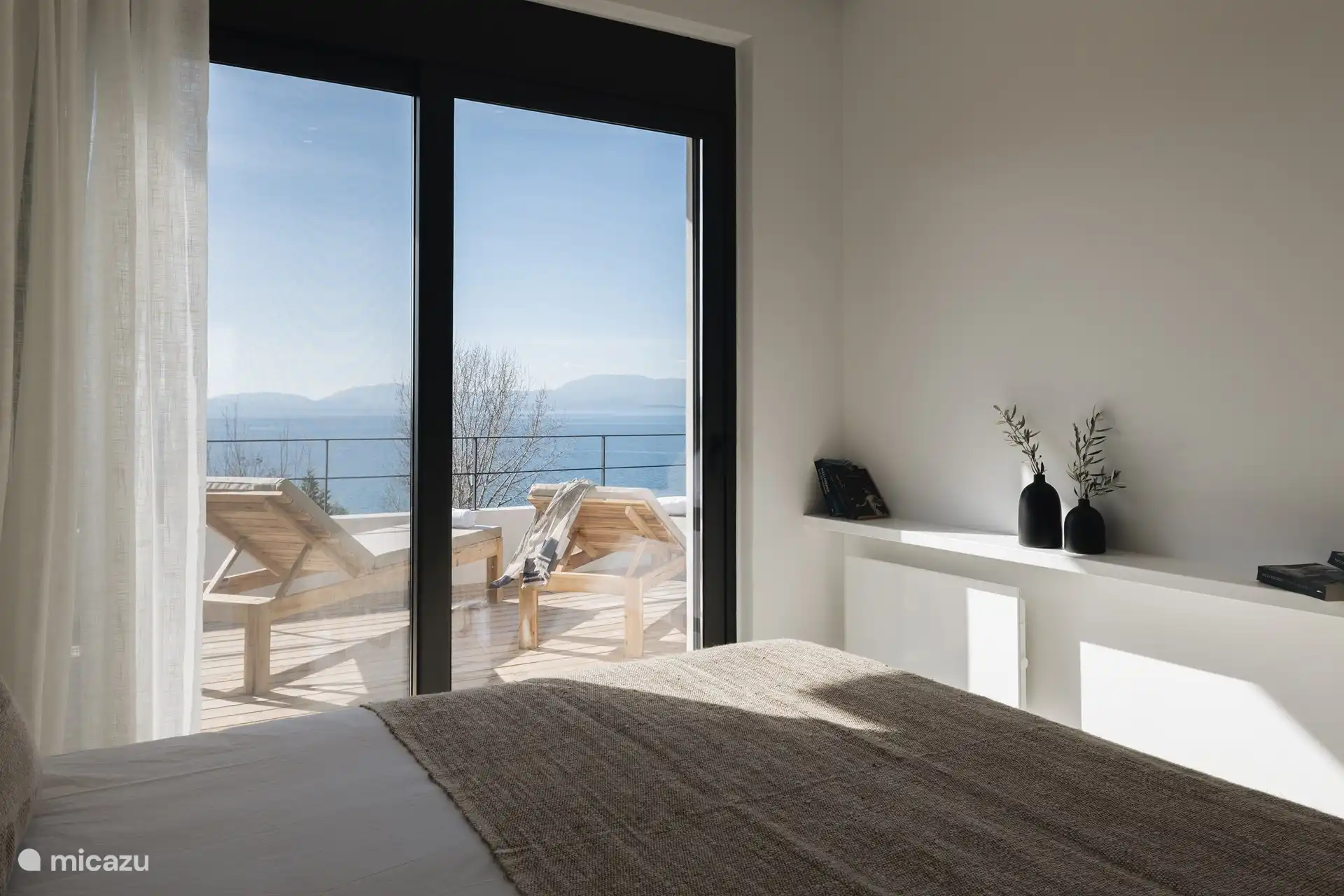 Bedroom with glass doors view 