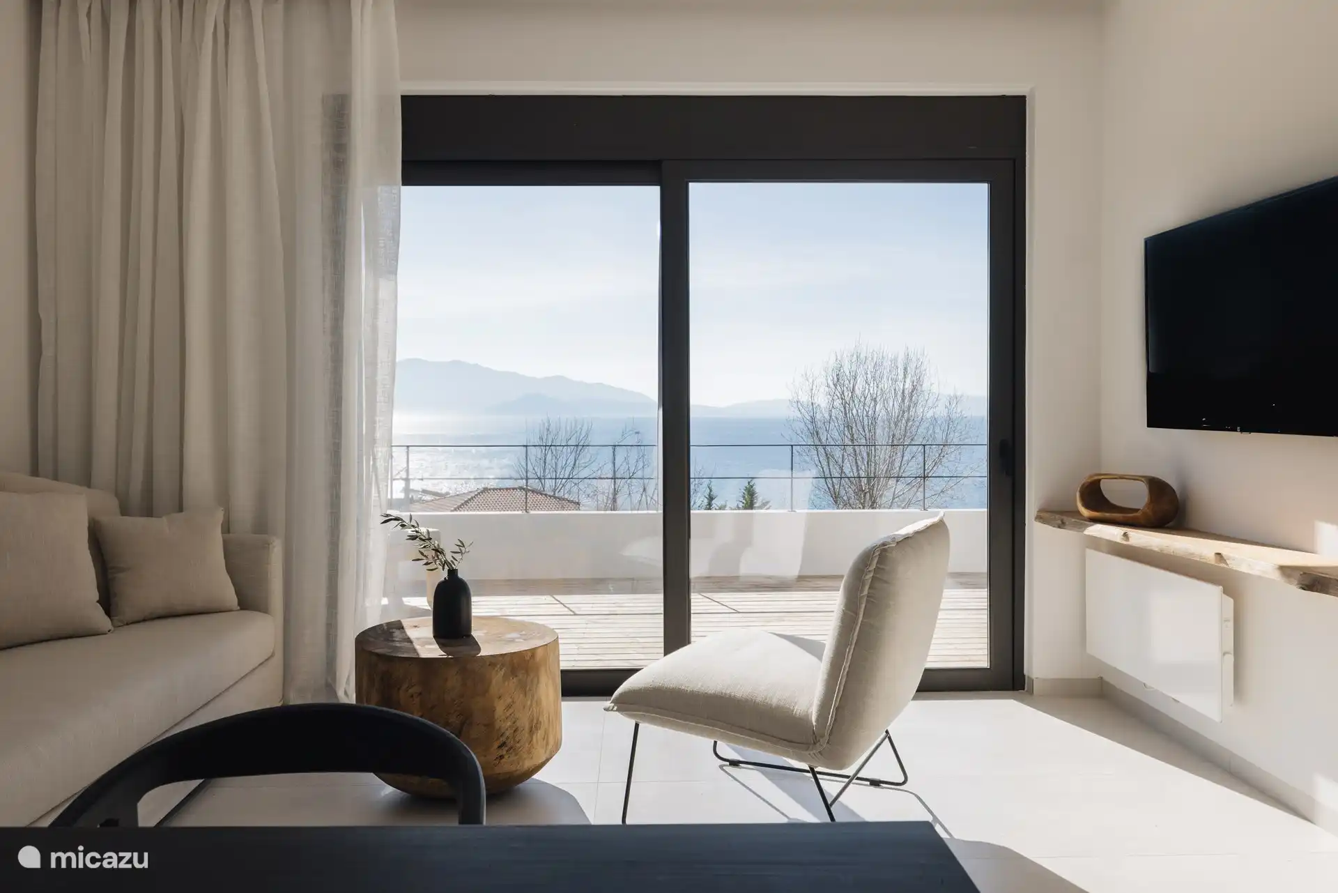 Indoor living area with glass doors view 