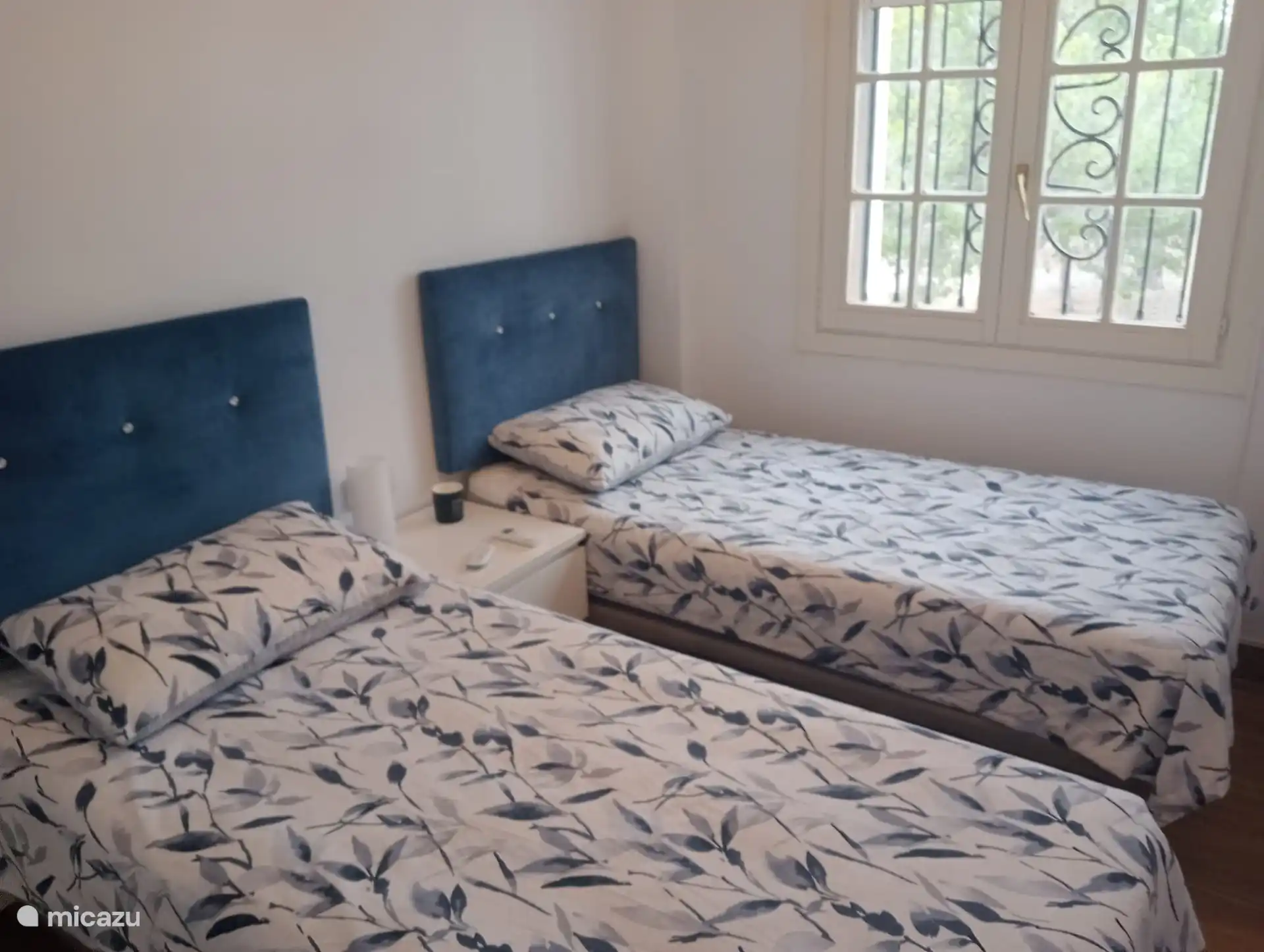 spacious second bedroom with 2 single beds.