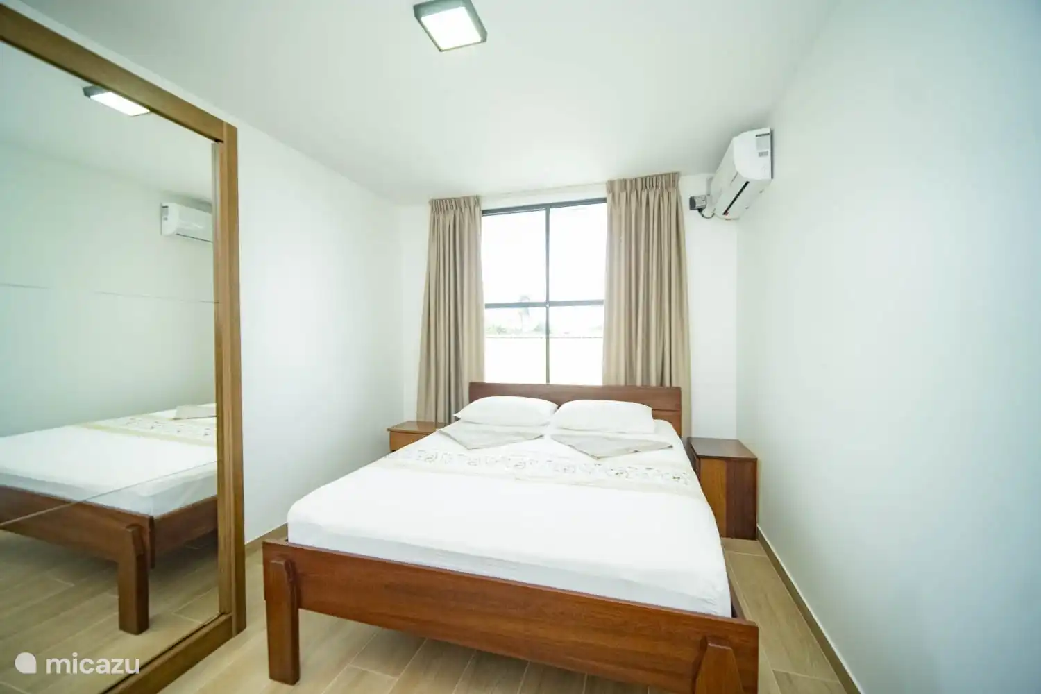  1st bedroom (Master bedroom) with double bed and equipped with air conditioning and a spacious wardrobe. There is also a mosquito net for windows.