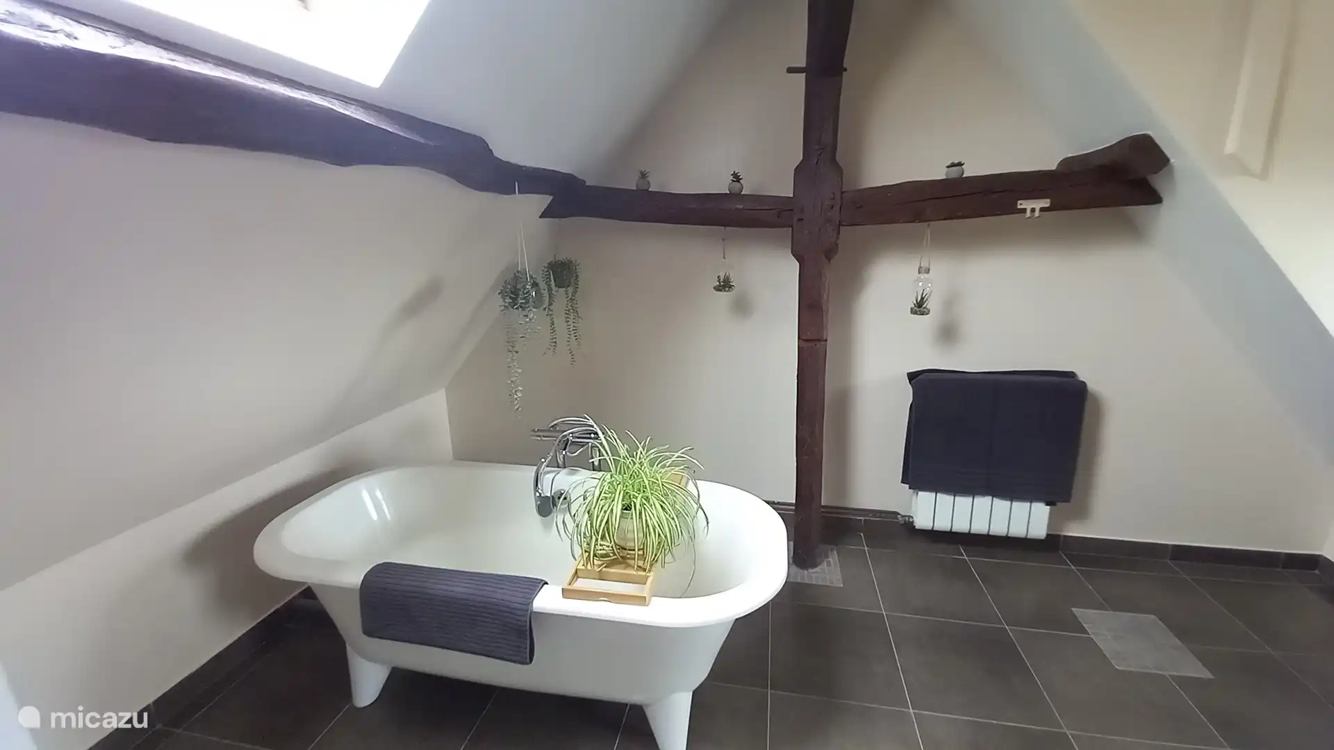 Large family bathroom with free standing bath, shower, WC and double basins.