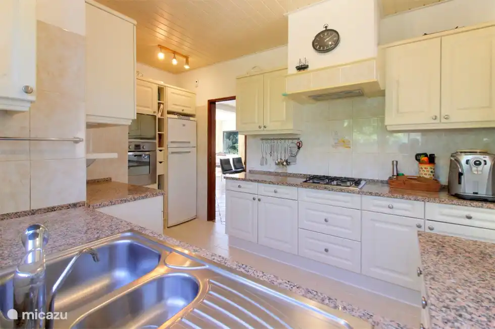 A spacious, neat kitchen with everything you need. Perfect for cooking together and enjoying delicious meals.