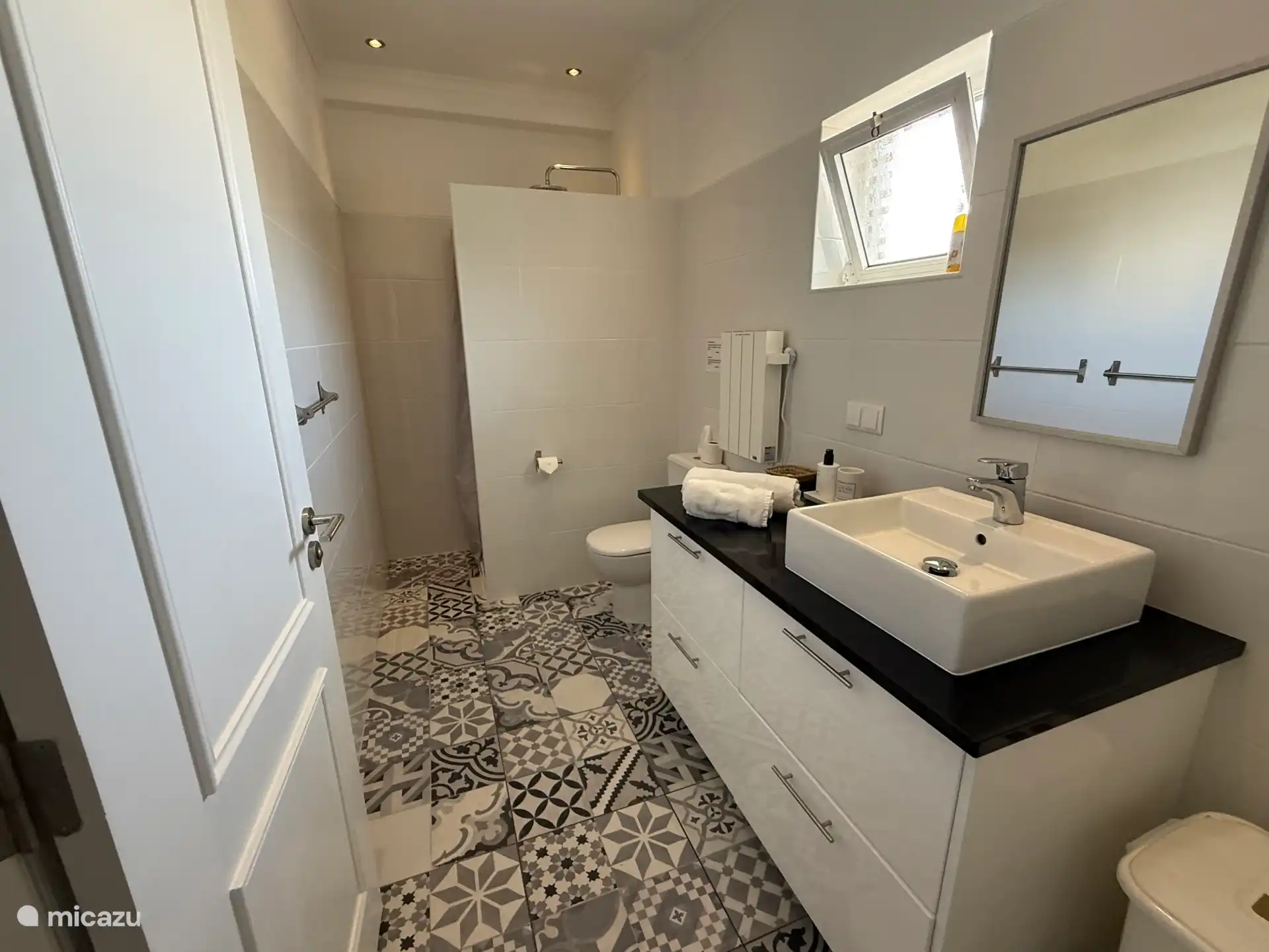 Luxurious bathroom with rain shower