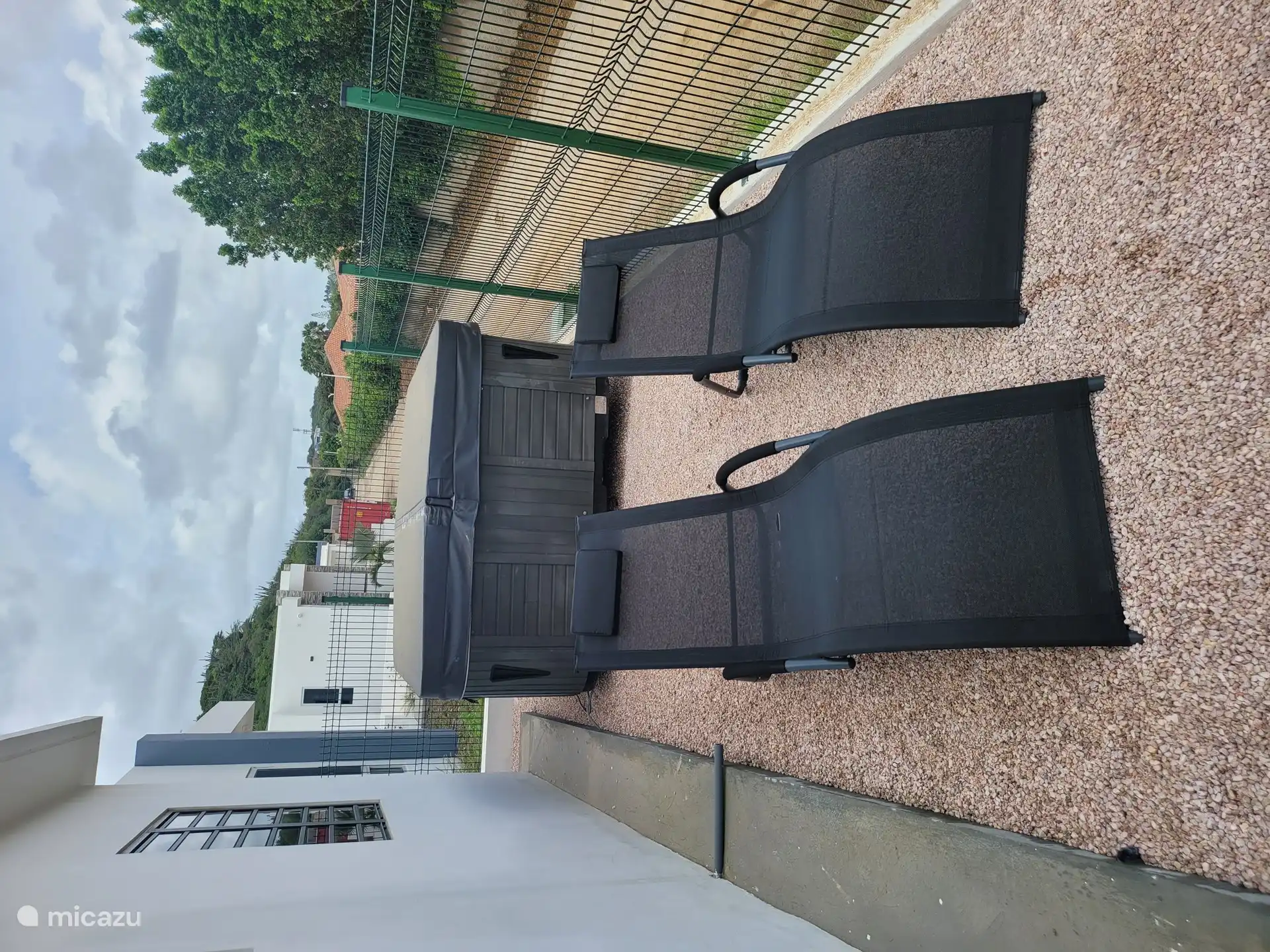 Lovely sun loungers in the side garden. The boundary has now been covered for your privacy.