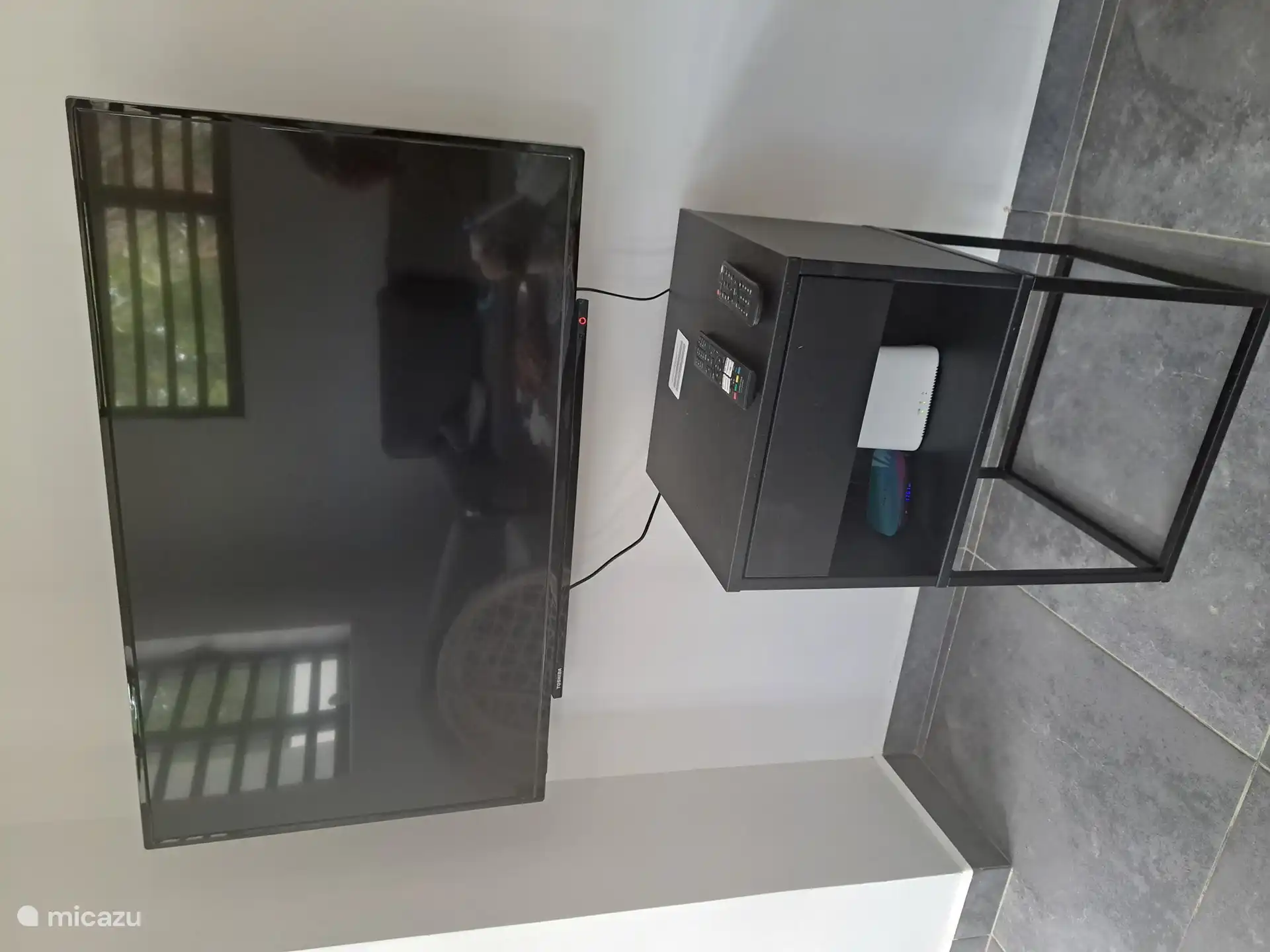 Large television with all channels including a library of the latest movies.