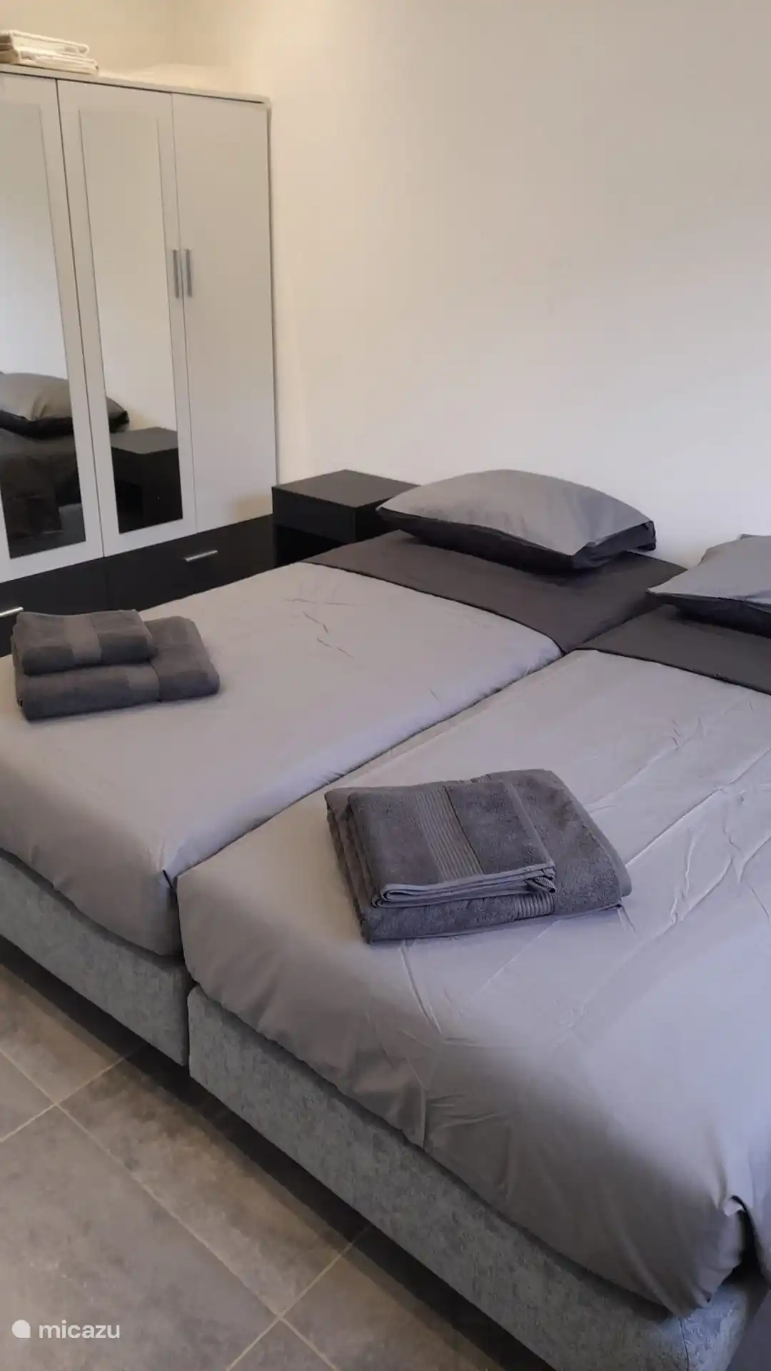 Main bedroom with large wardrobe and private bathroom