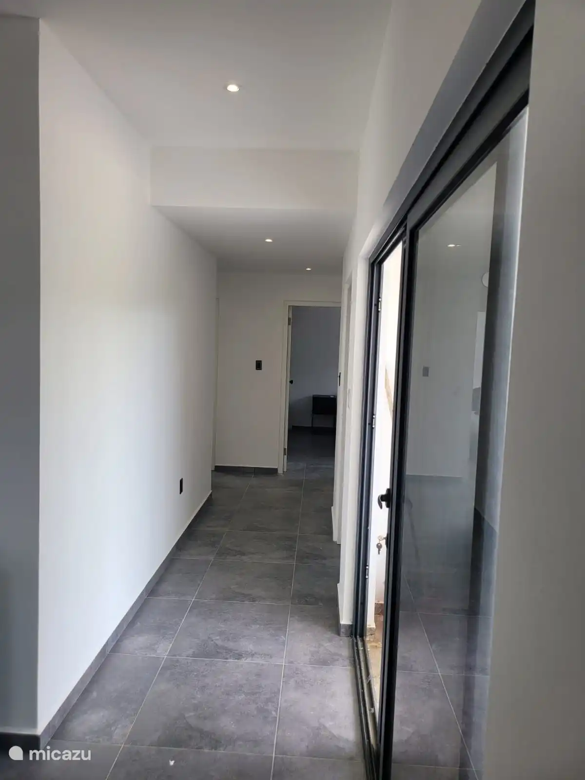 Corridor to the various interior rooms and porch