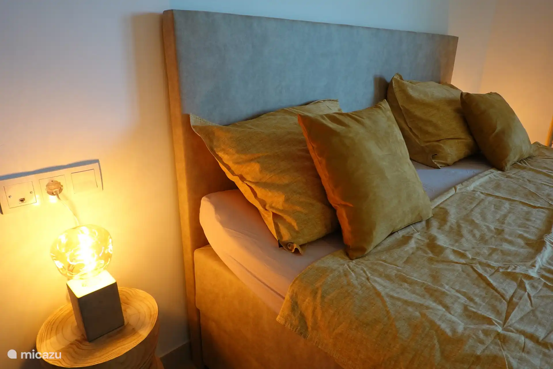 This romantic bedroom embraces you with its soft colors, like a warm hug at the end of a long day.