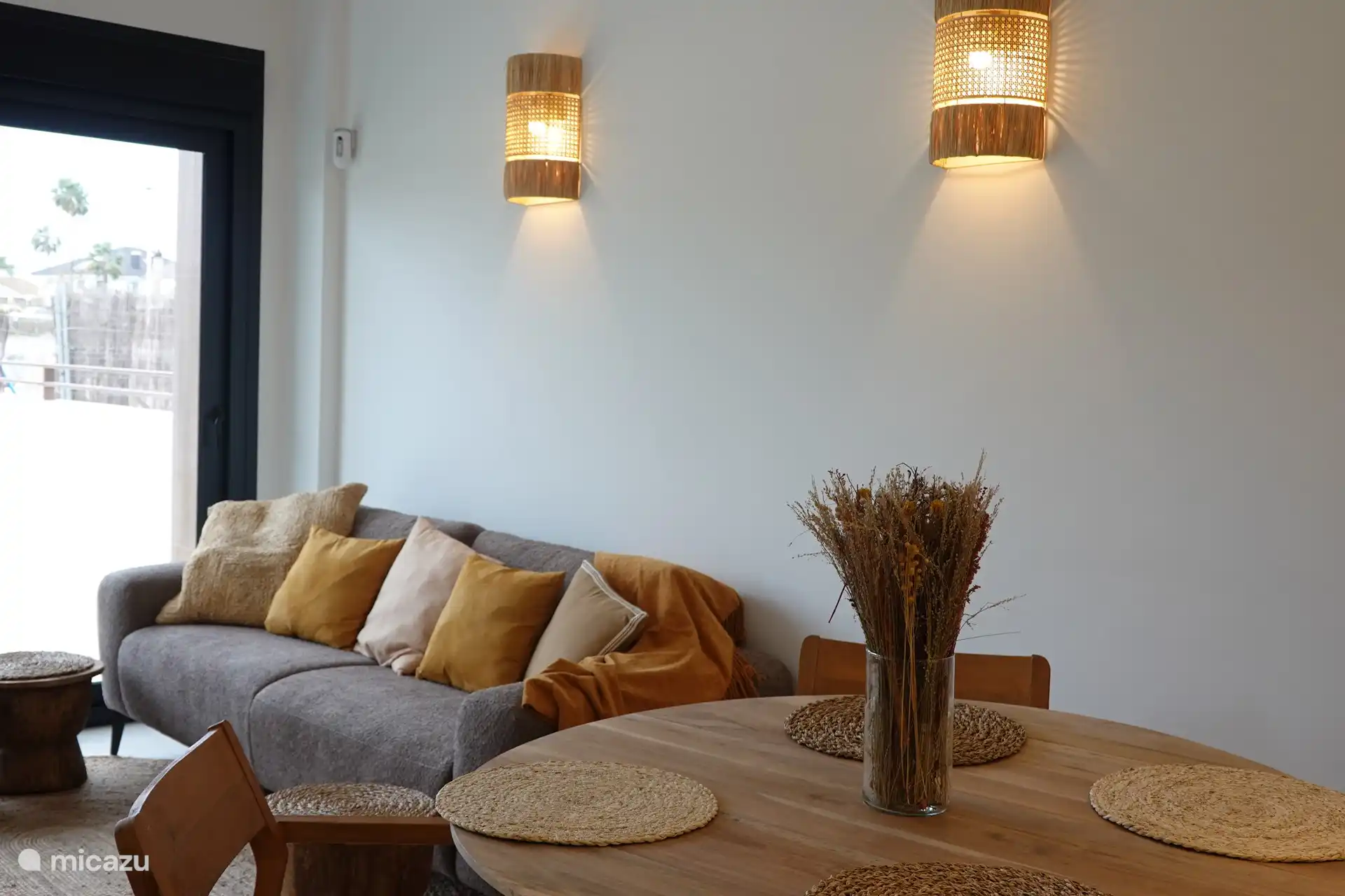 Cozy living space with access to the terrace and view of the swimming pool