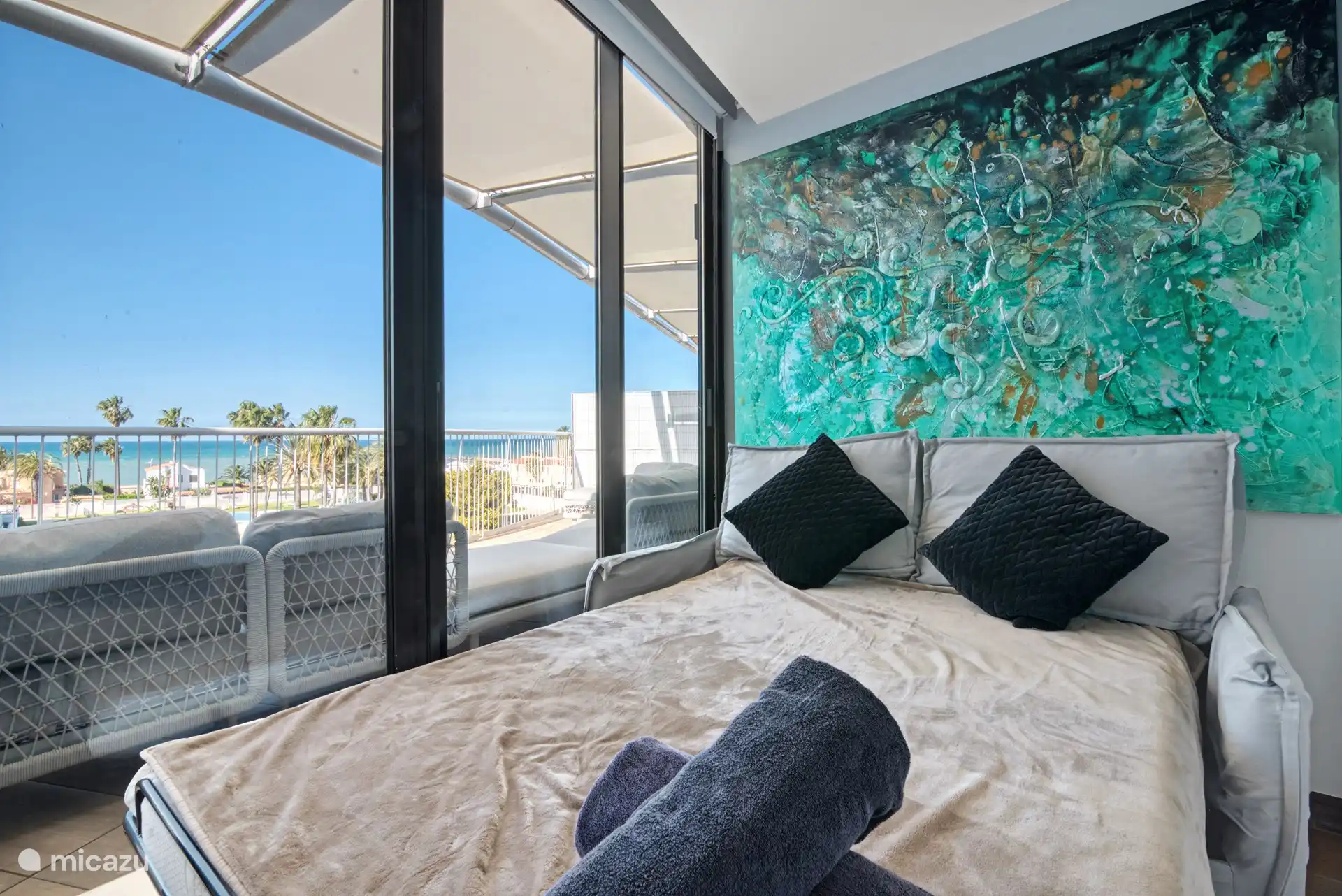 different perspective of the smallest bedroom, which also has a smart TV and its own built-in wardrobe.