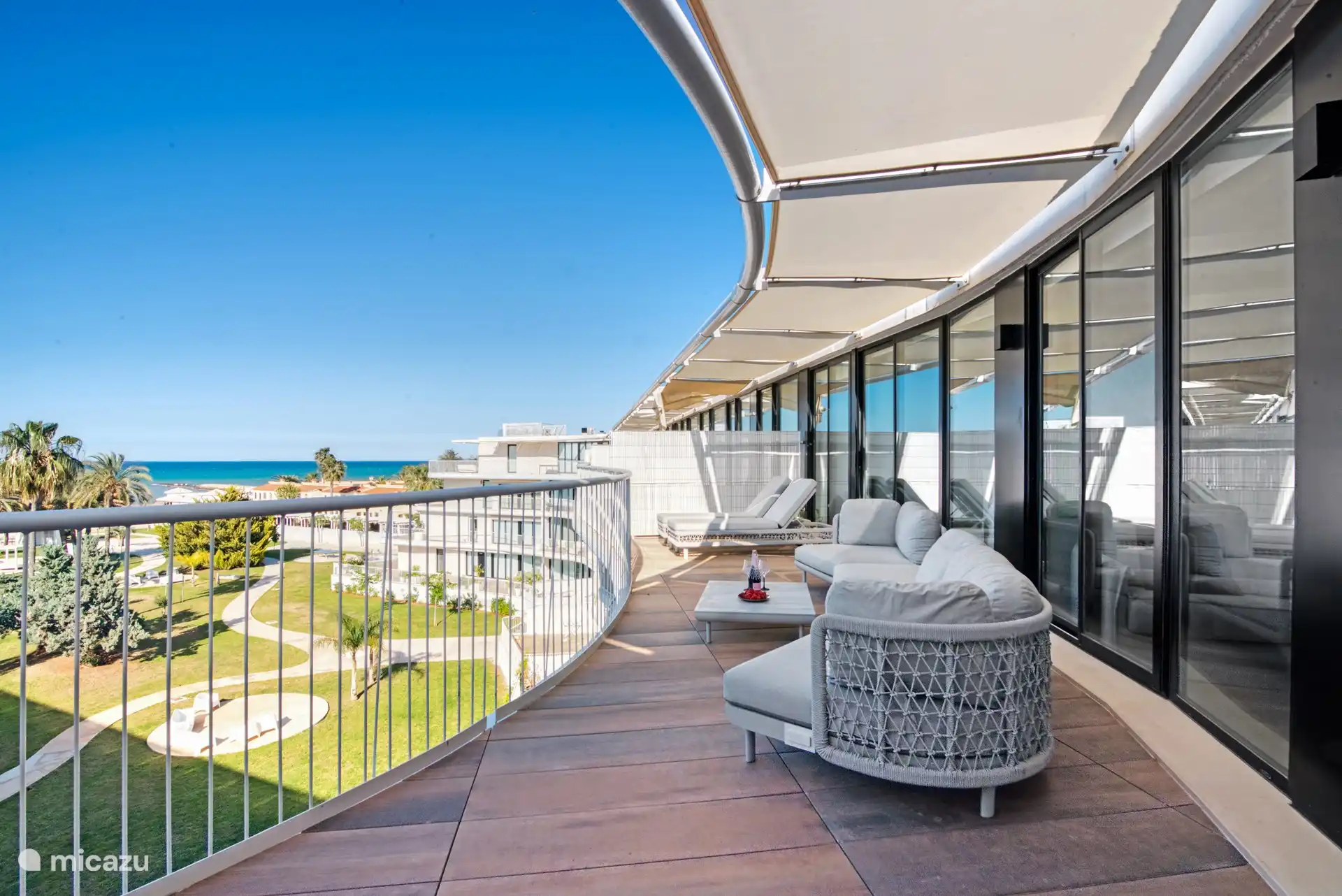 perspective from the sliding living room to the right. This image also clearly shows the spacious terrace.