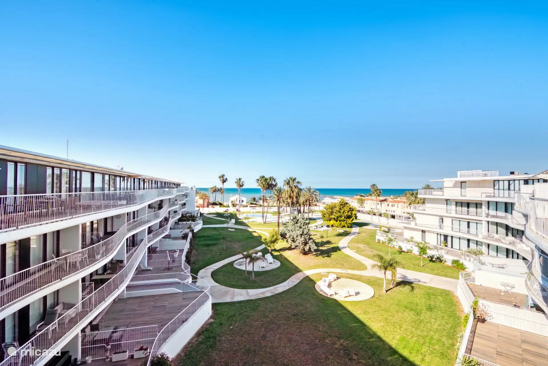 view from the terrace of the garden of the complex. The garden is perfectly maintained.