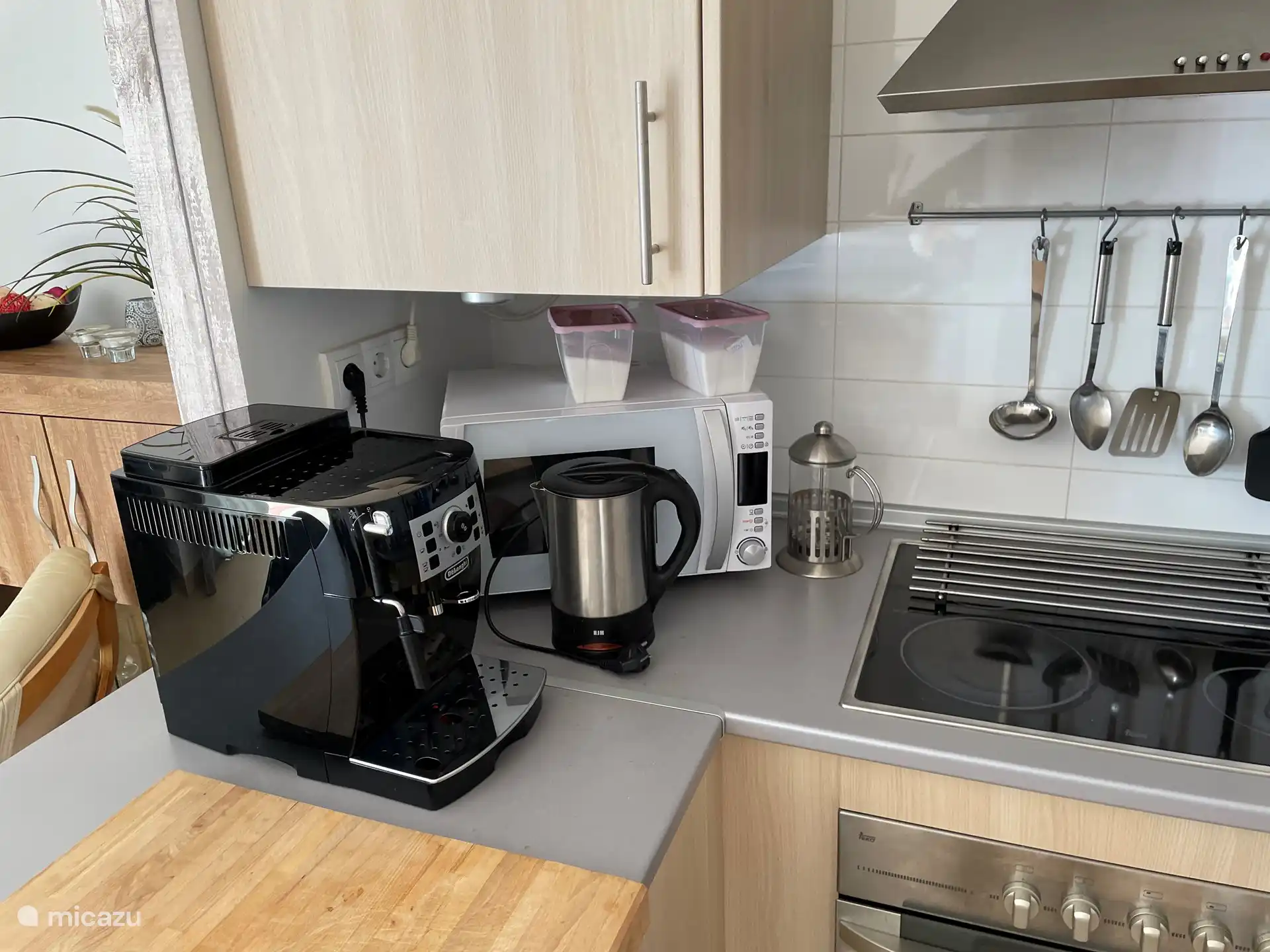 Luxury coffee maker with coffee beans, over and hob