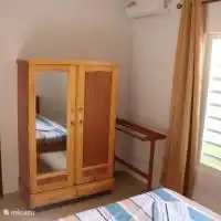 Both identical bedrooms have a double bed and a wardrobe.