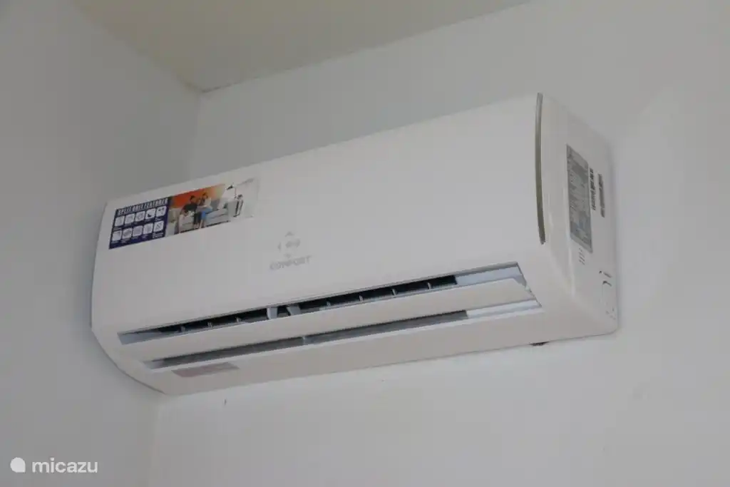 Both bedrooms and the living room are equipped with air conditioning.