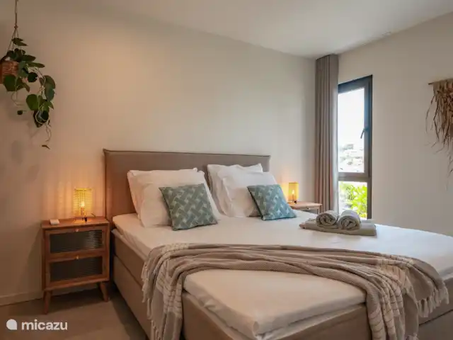 Location de Vacances Curaçao, Curaçao-Centre, Willemstad, appartement - L’appartement de luxe The Wharf MT Réveillez-vous merveilleusement dans cette chambre luxueuse.