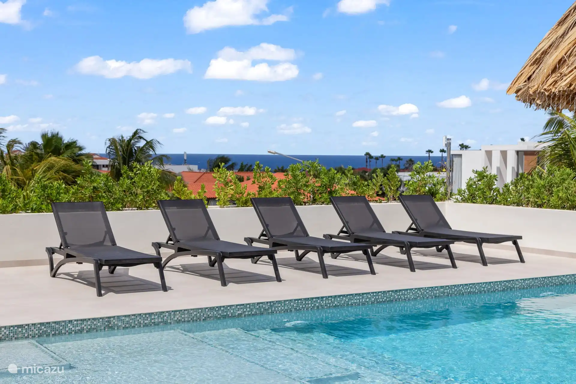 Enjoying the sun by the private pool
