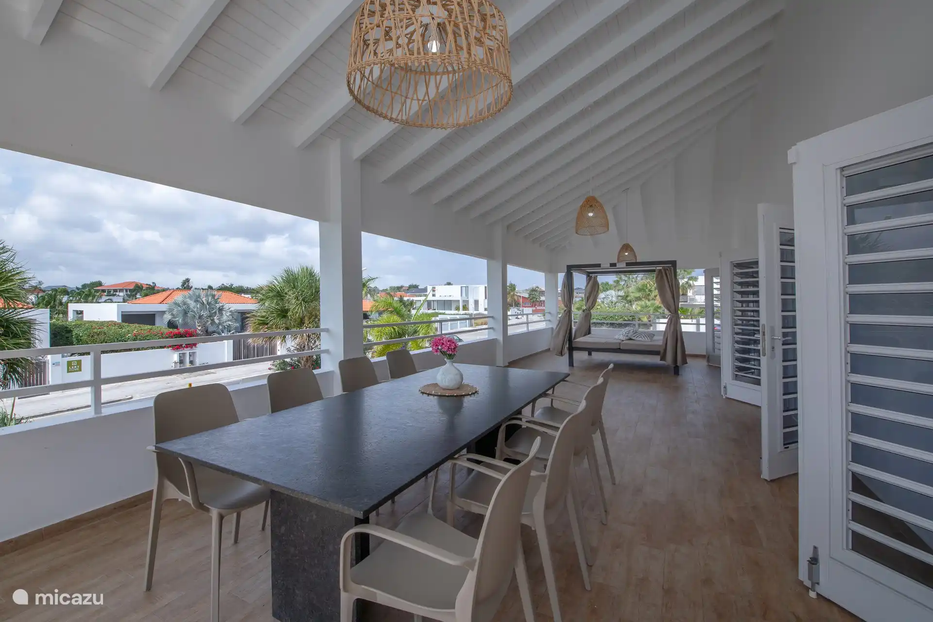 Spacious veranda with lounger and dining table