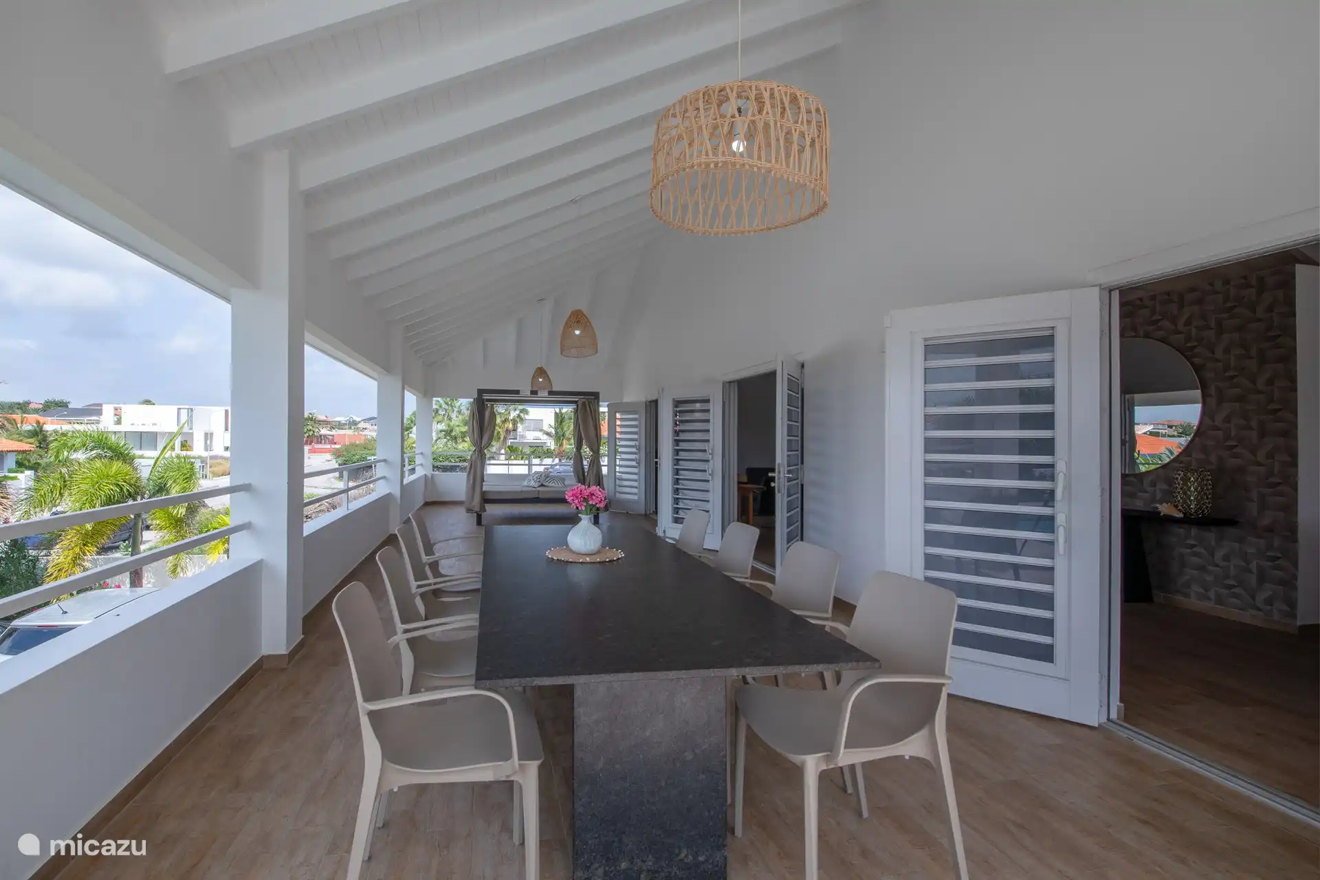 Spacious veranda with lounger and dining table