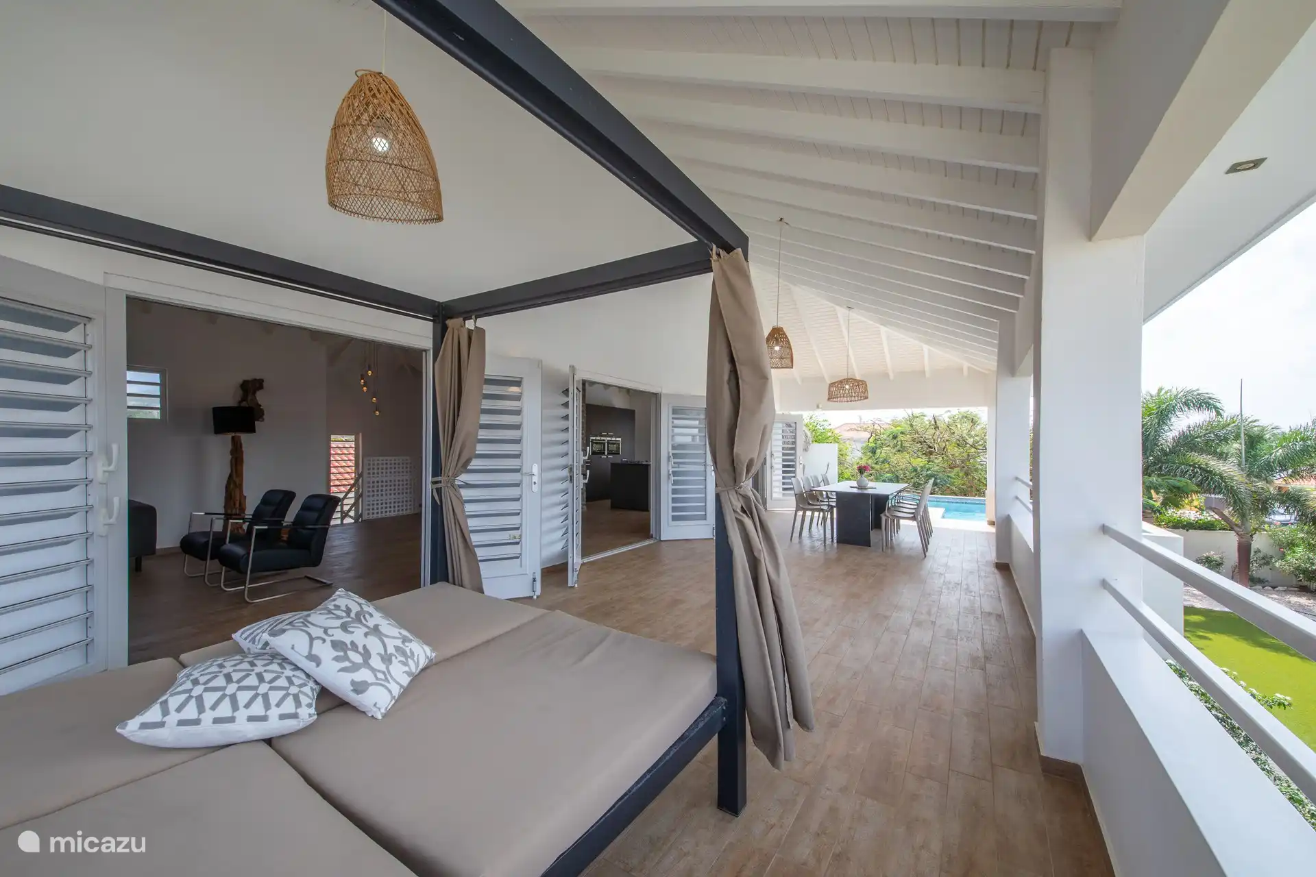 Spacious veranda with lounger and dining table