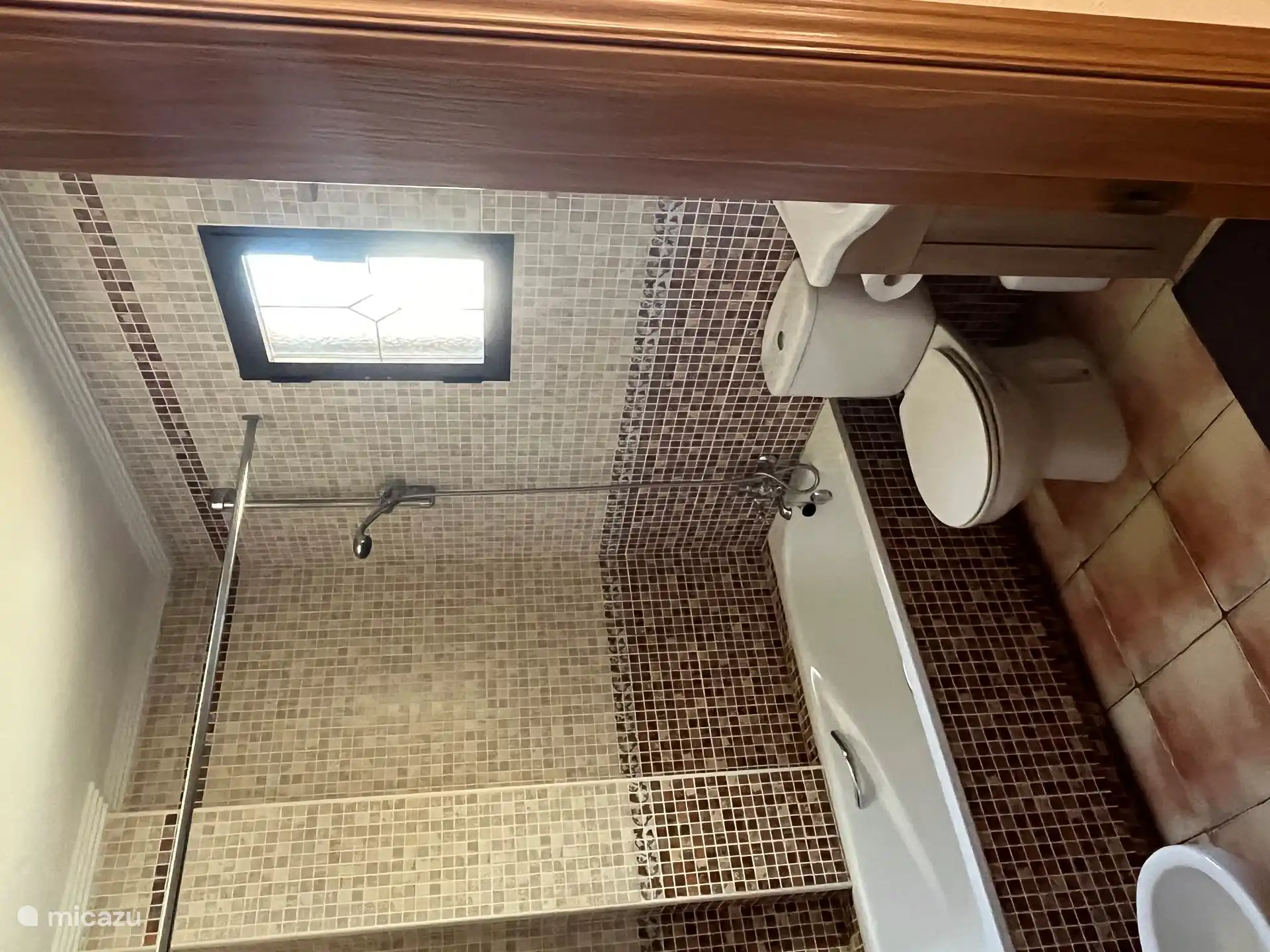 Bathroom in the master bedroom, with sink, bidet, toilet and large bath.