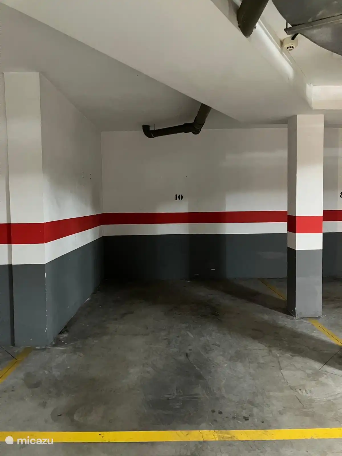 Place de parking fixe dans le garage souterrain 