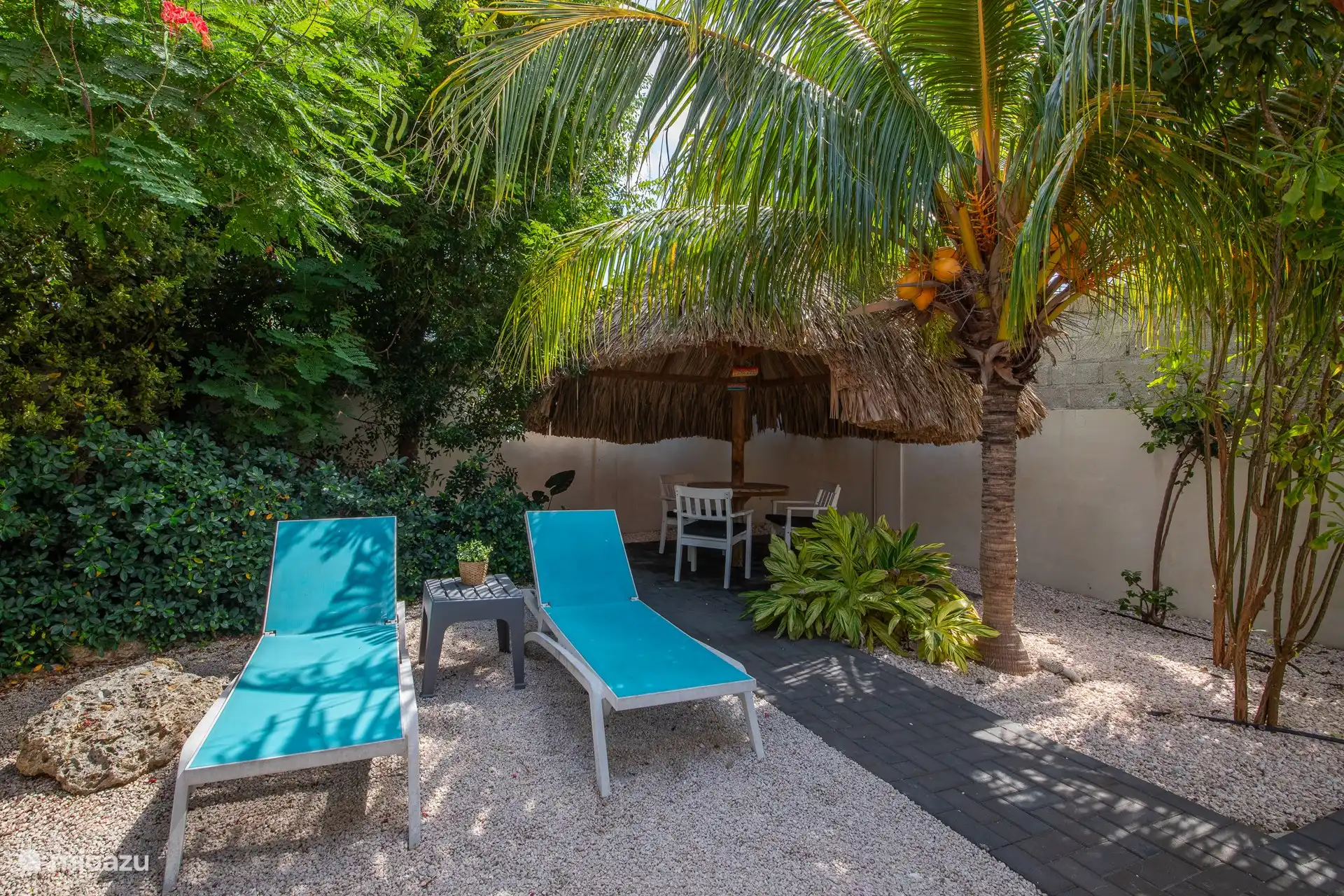 Two-person apartment with private terrace. Seat under the palapa.