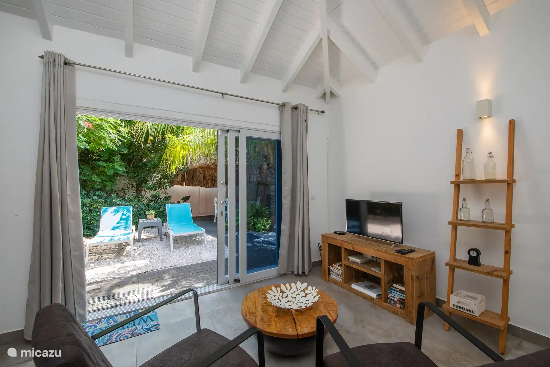 Living room and kitchen in one room.
Armchairs, coffee table and TV