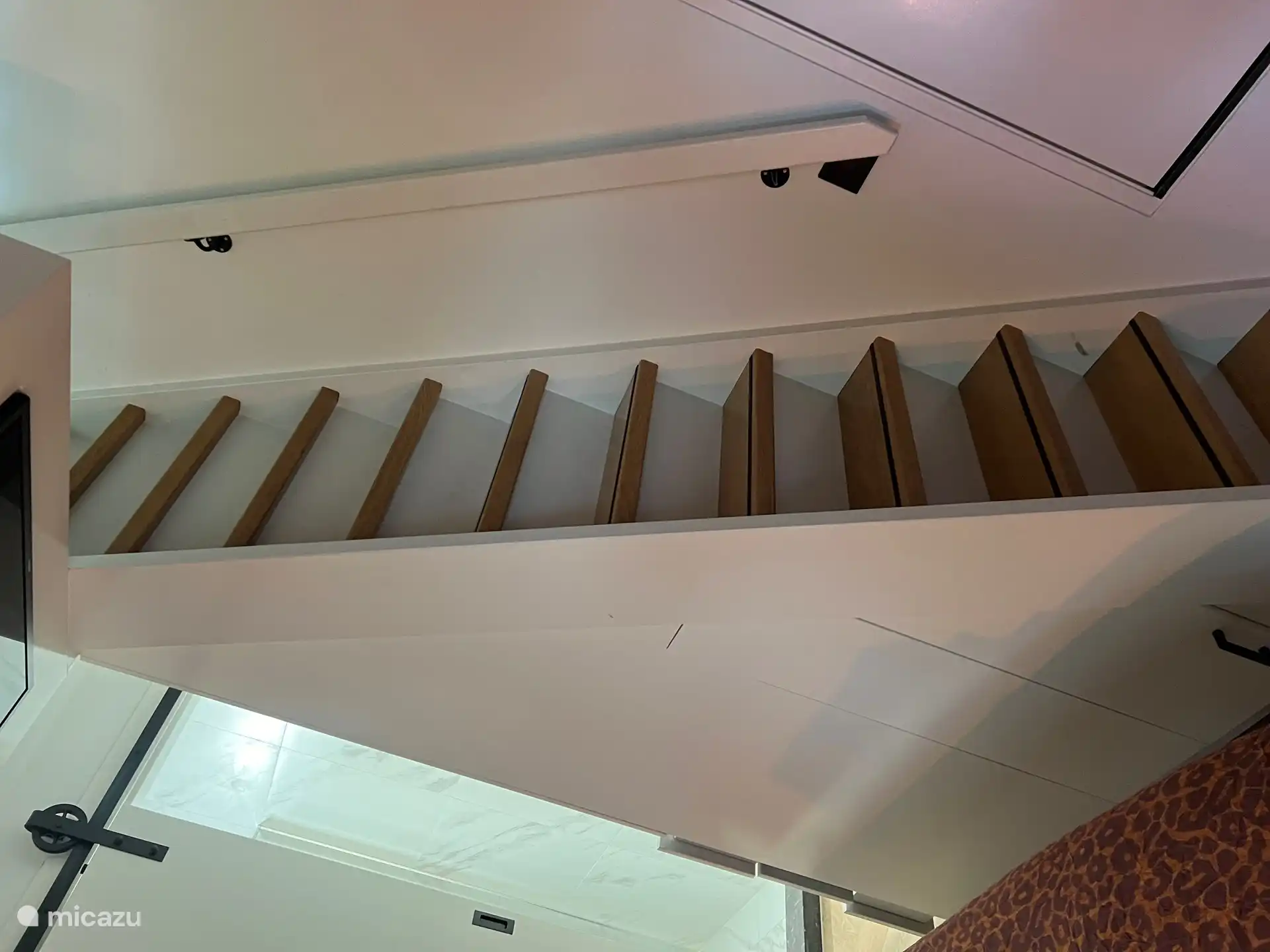 Stairs in the bedroom to the sleeping loft on the 1st floor 