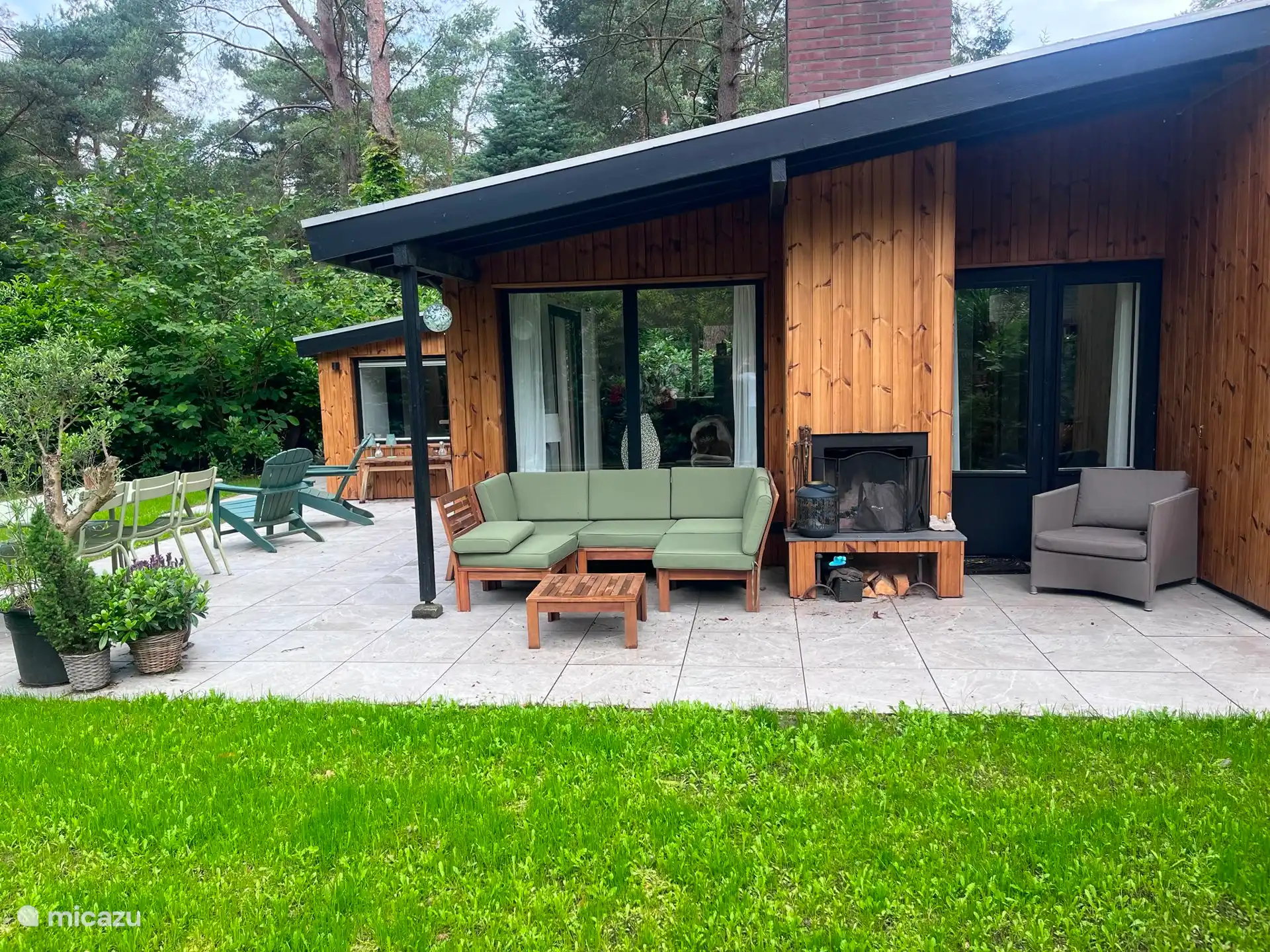 An outdoor fireplace with seating. 