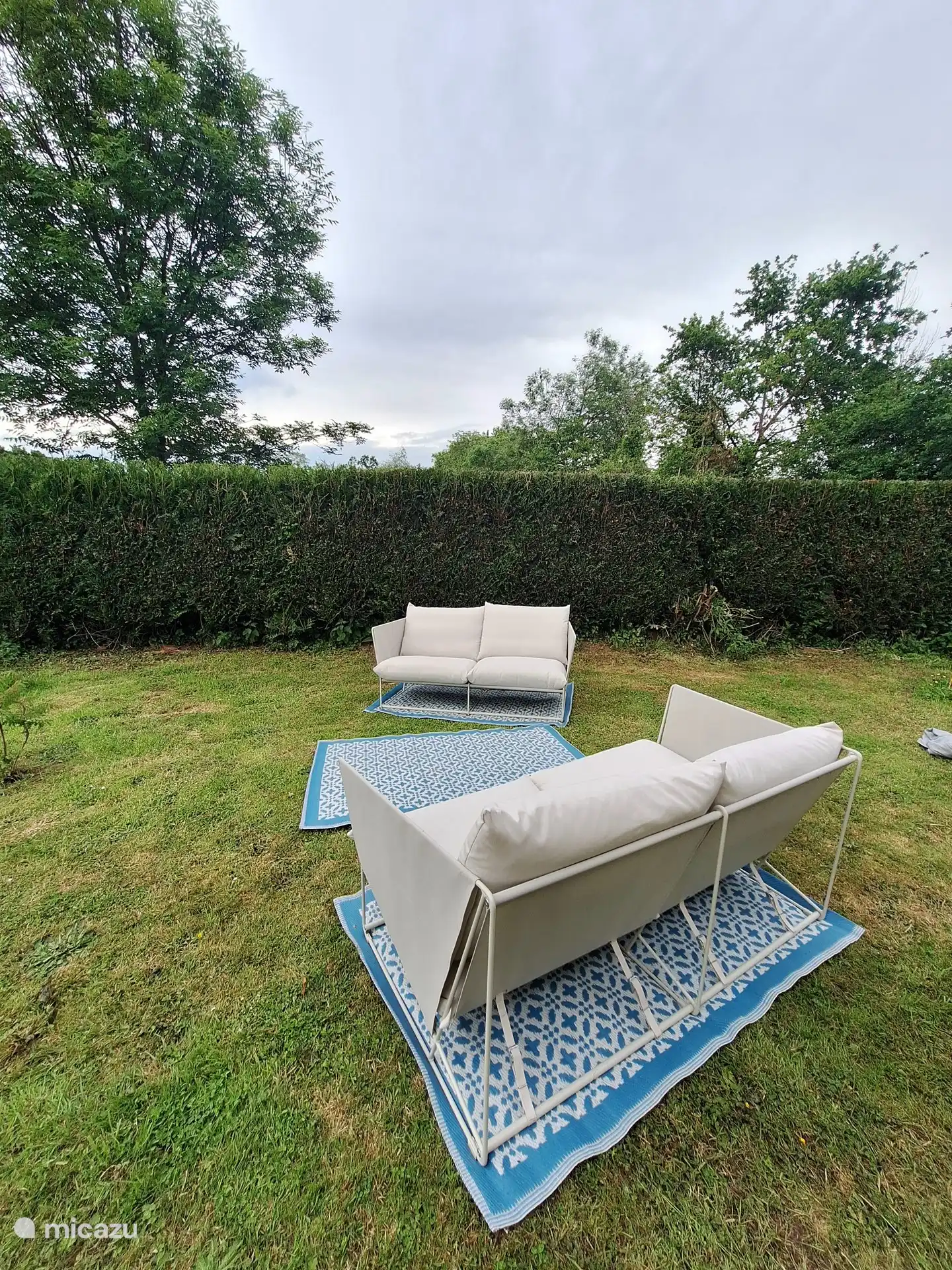 A lovely seat on the side of the house.