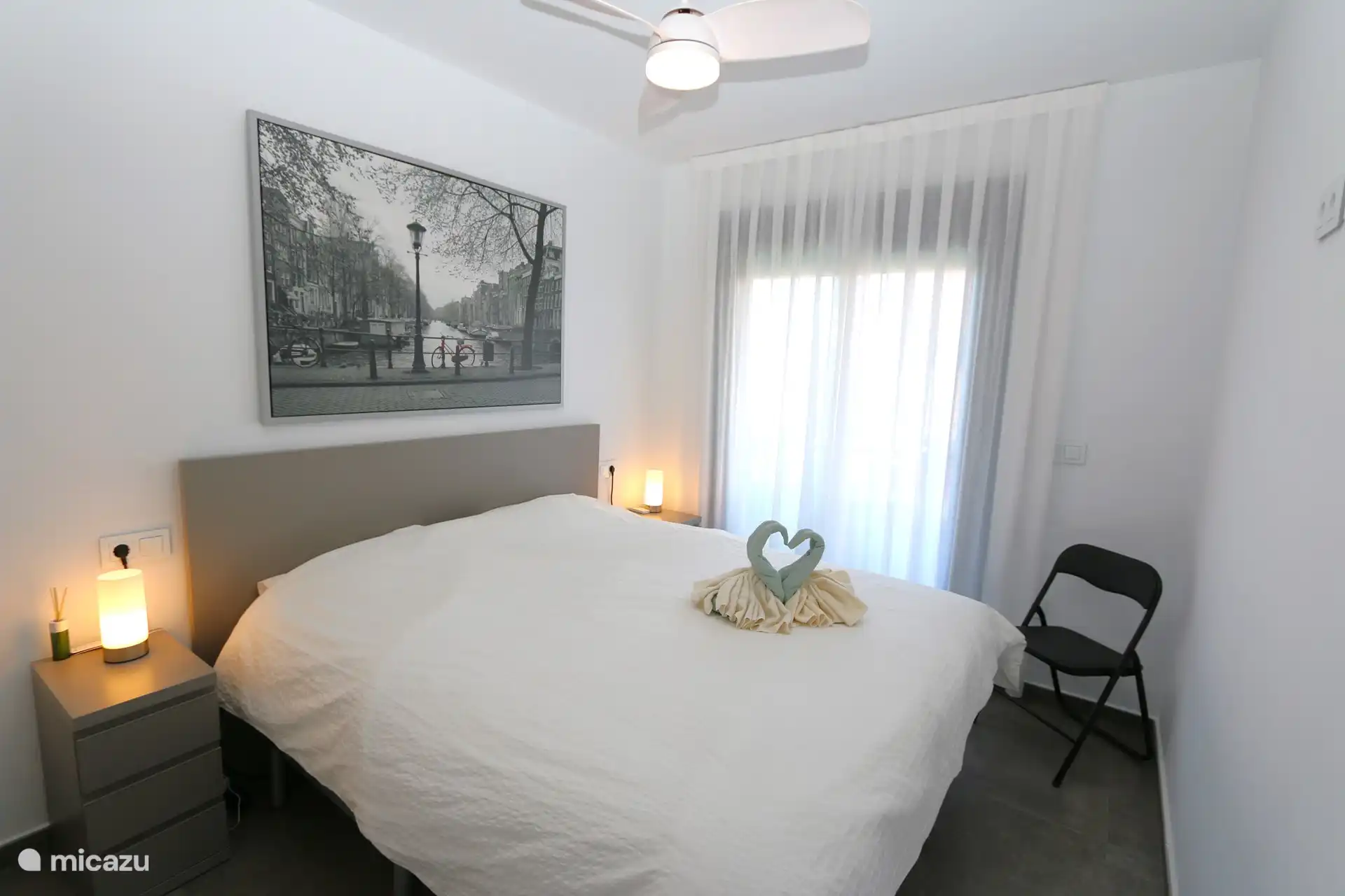 The double bed of the other bedroom.