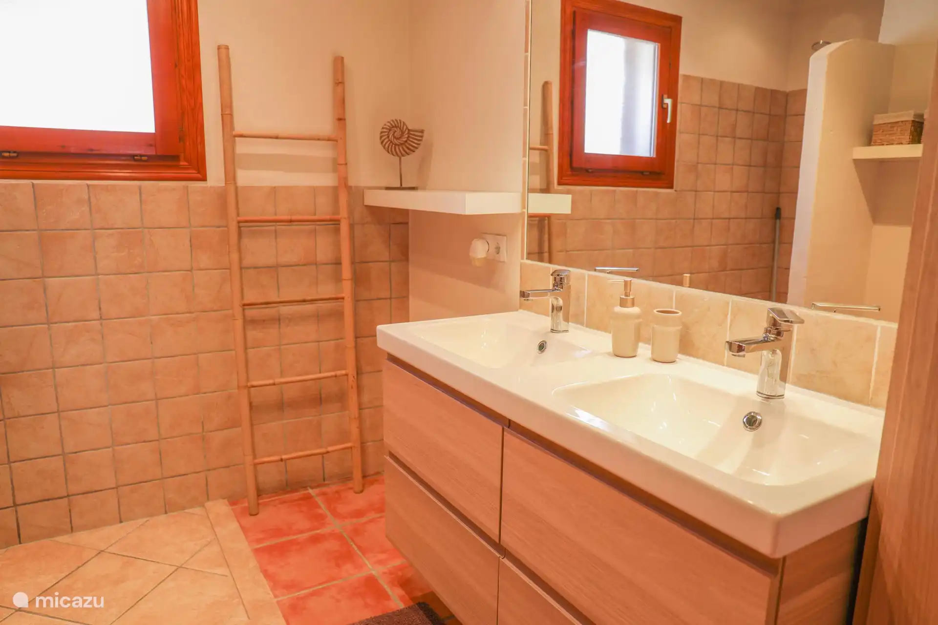 Bathroom with shower and double sink