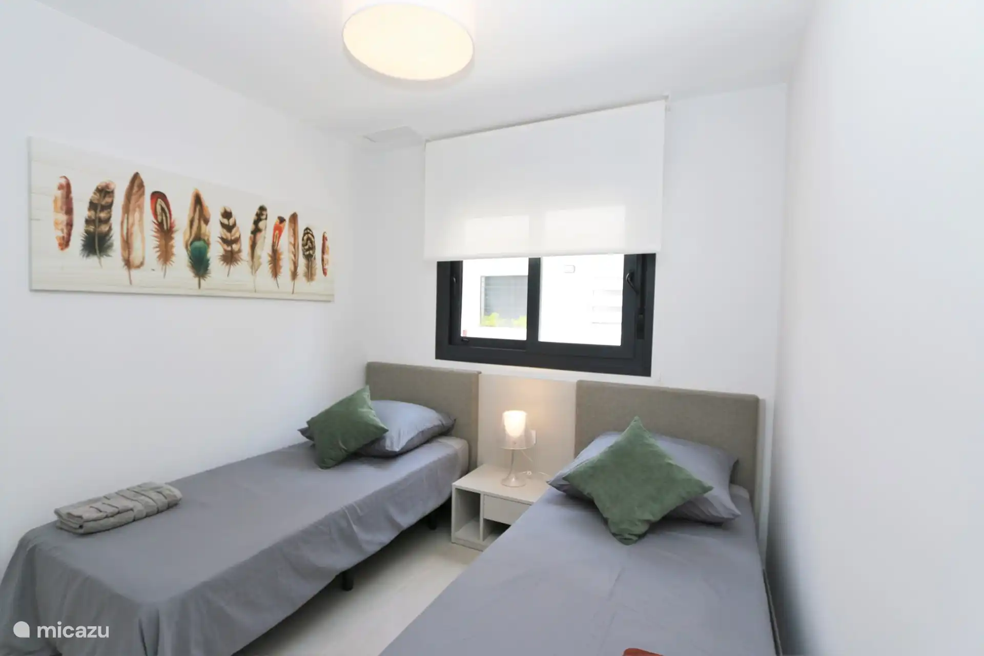 Chambre avec deux lits simples