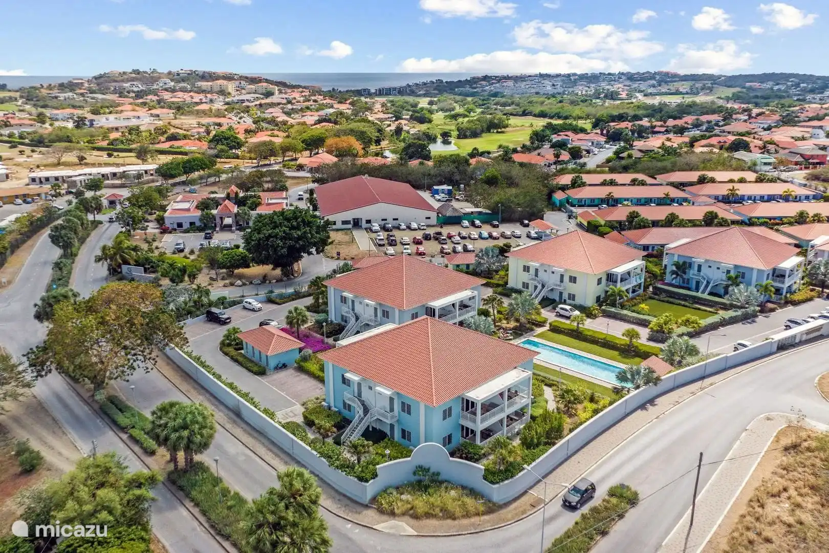 The small-scale resort, with Bllue Bay and the greens of the beautiful Blue Bay Golf resort in the background.