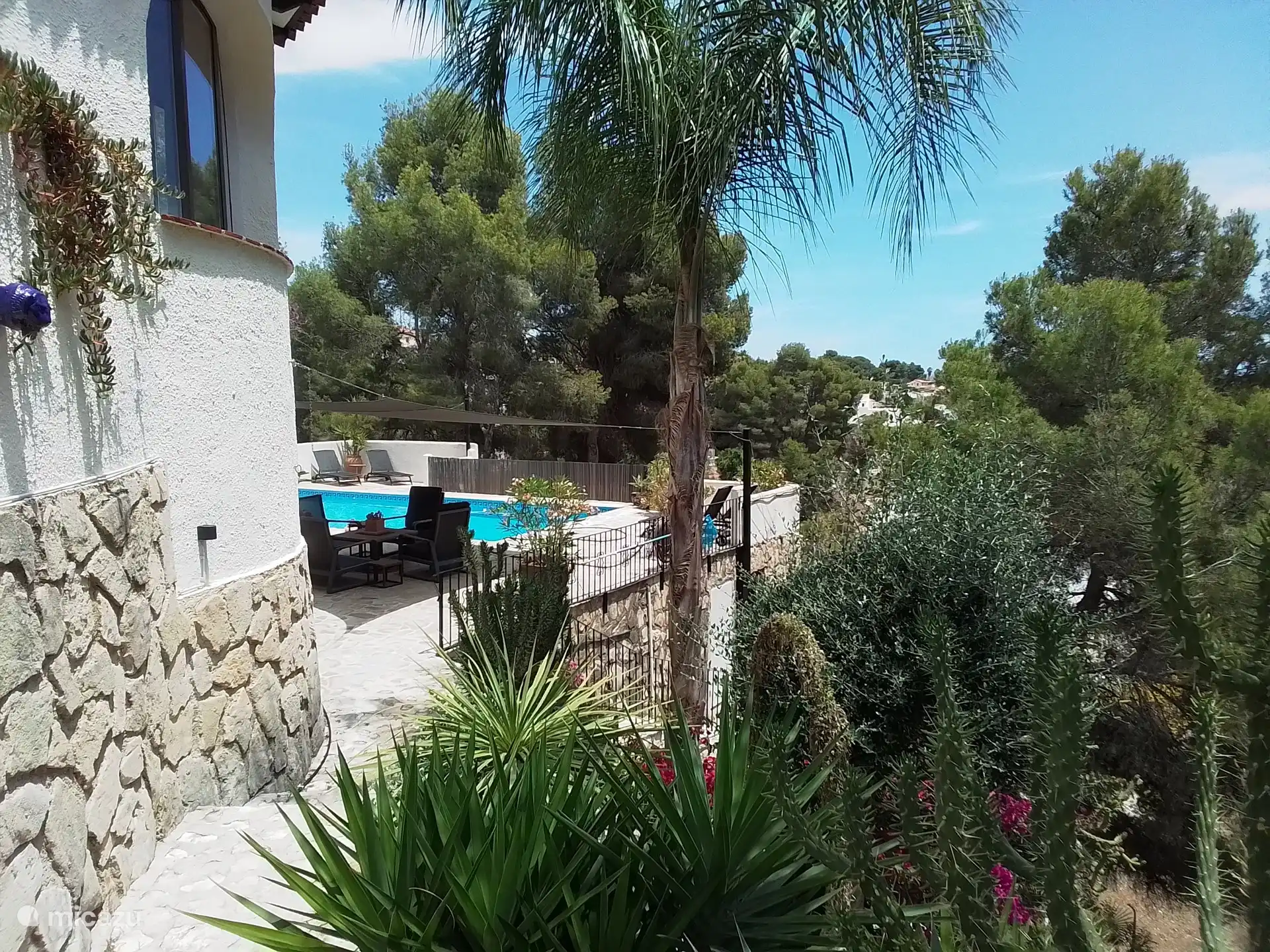 View down from the stairs of the villa. To the right is the barbecue terrace