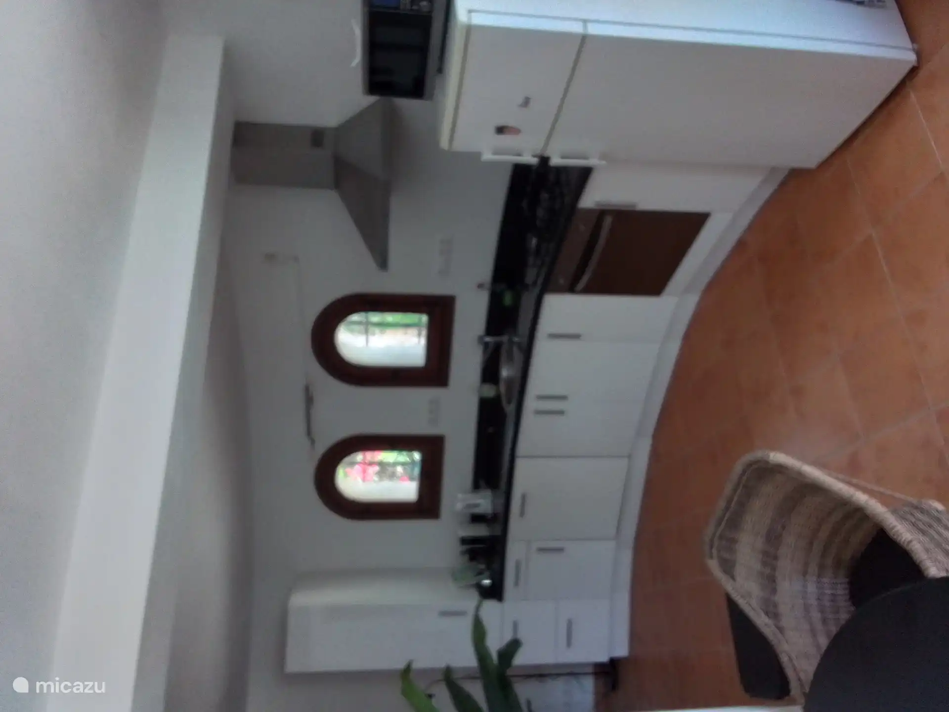 Kitchen apartment with dishwasher, oven and gas hob.