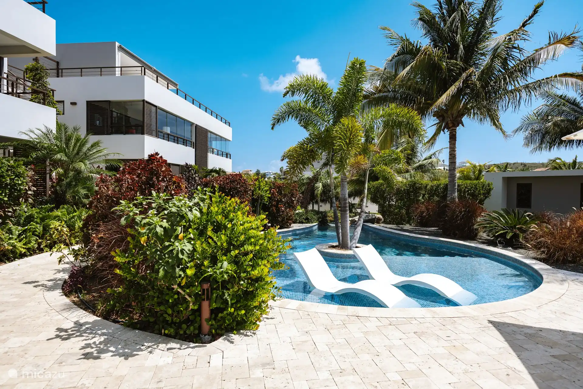 The amazing gardens with beautiful pools connected by a waterfall.