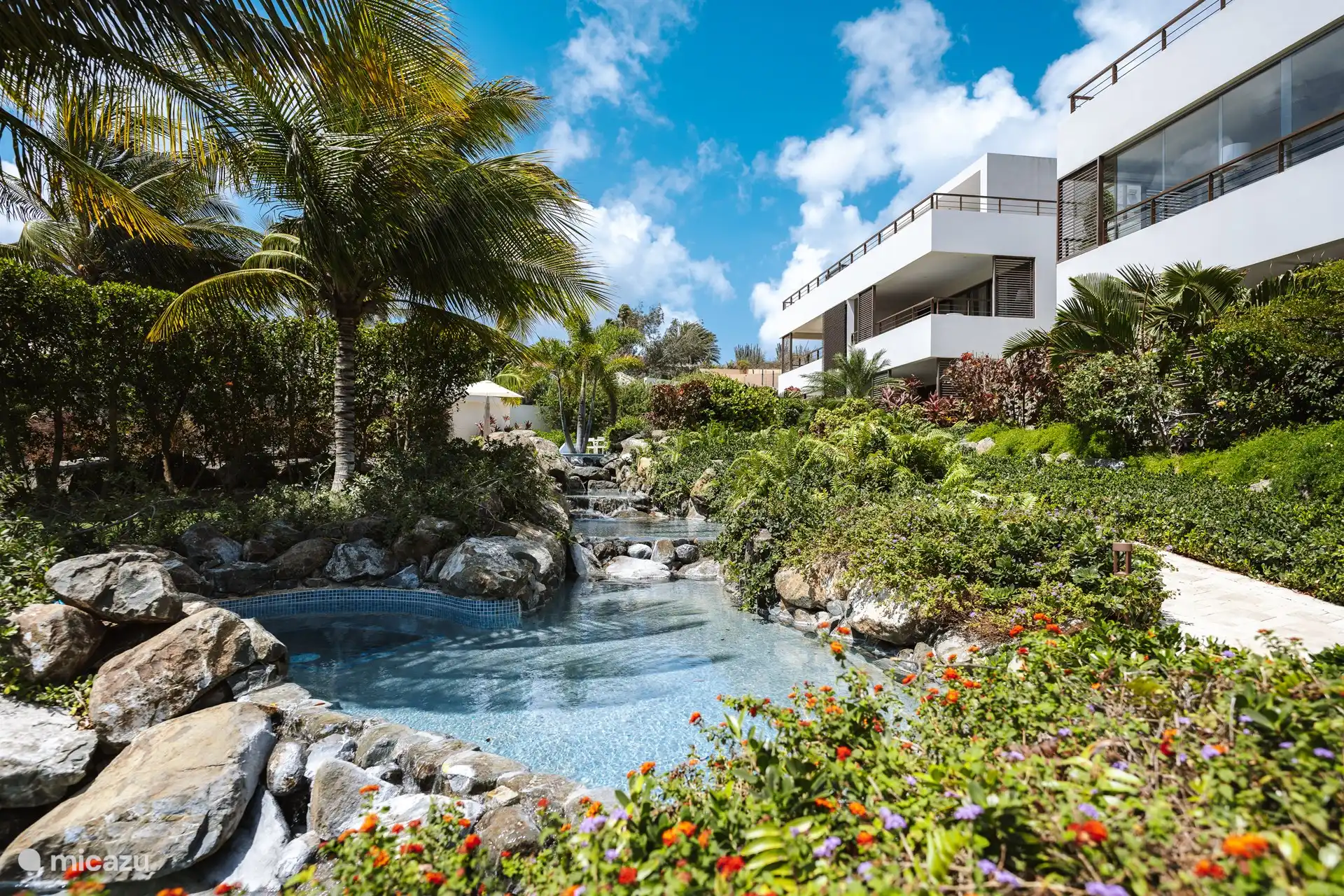 The beautiful waterfalls, where you can also sit in this section. Among the tropical plants.