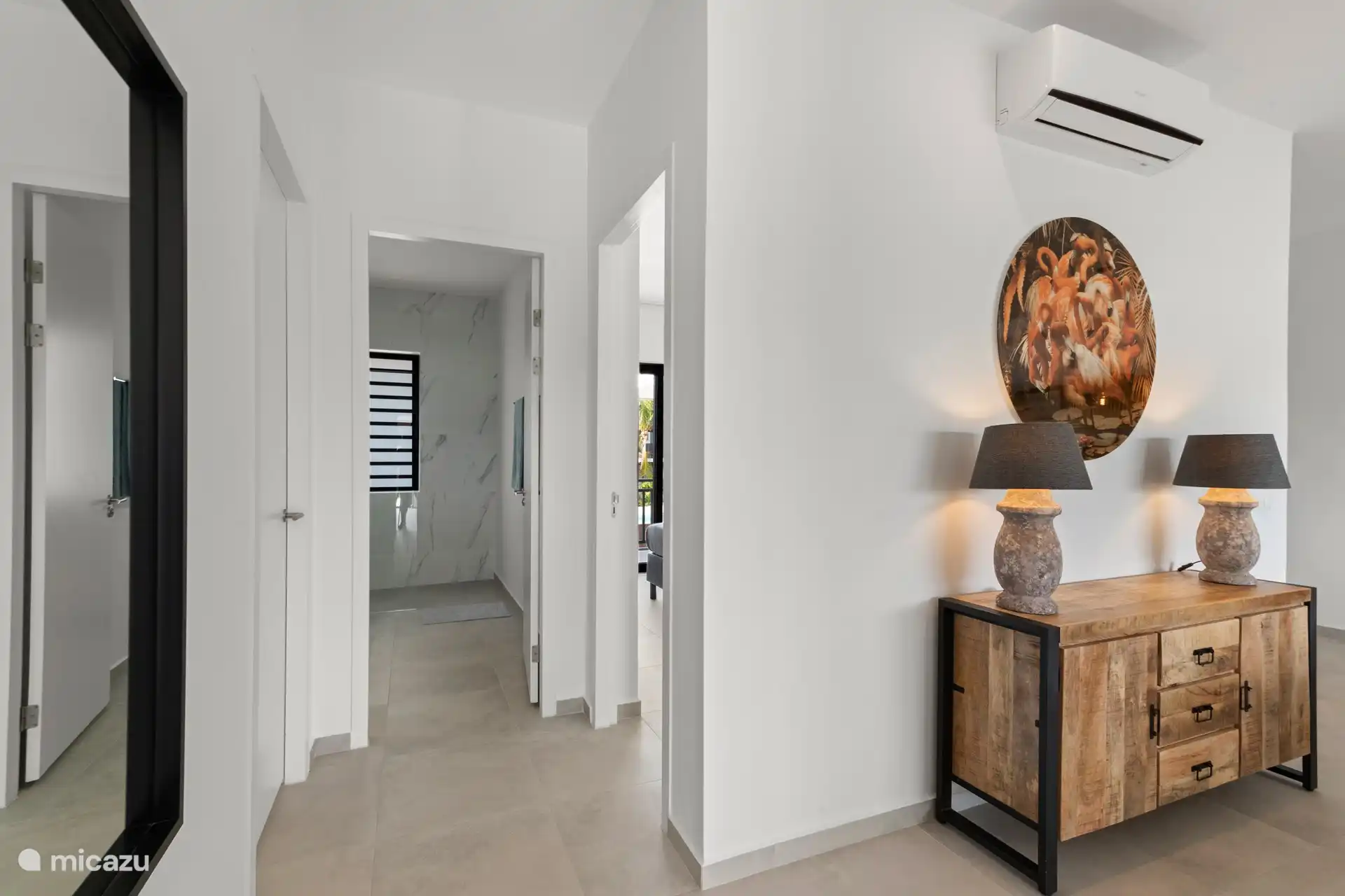 From the living room you walk to the other two bedrooms