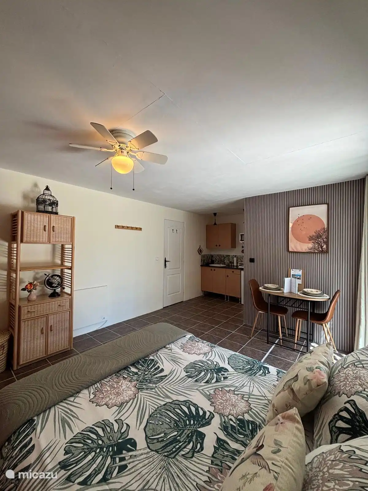 Bed, kitchen and dining area 