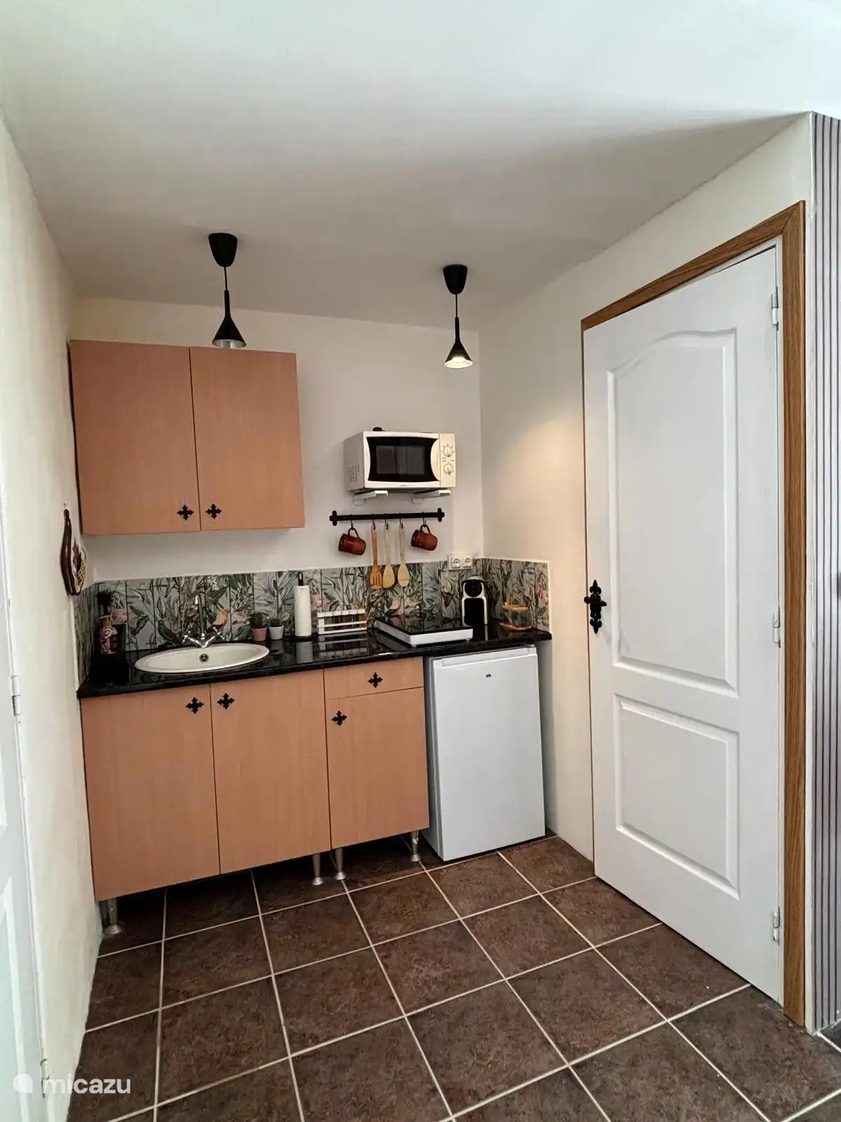 Kitchen with door to the bathroom
