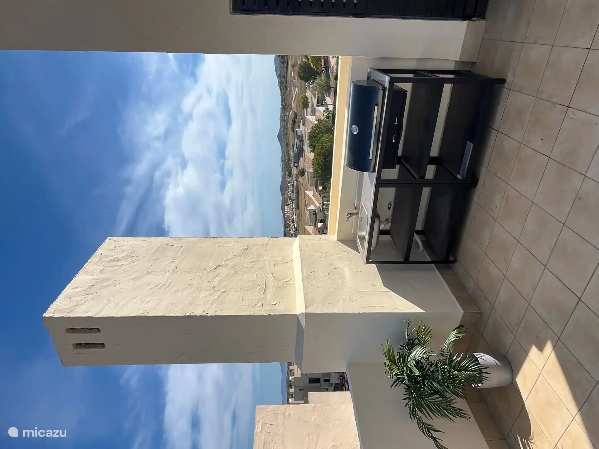 Terraza en la azotea con barbacoa