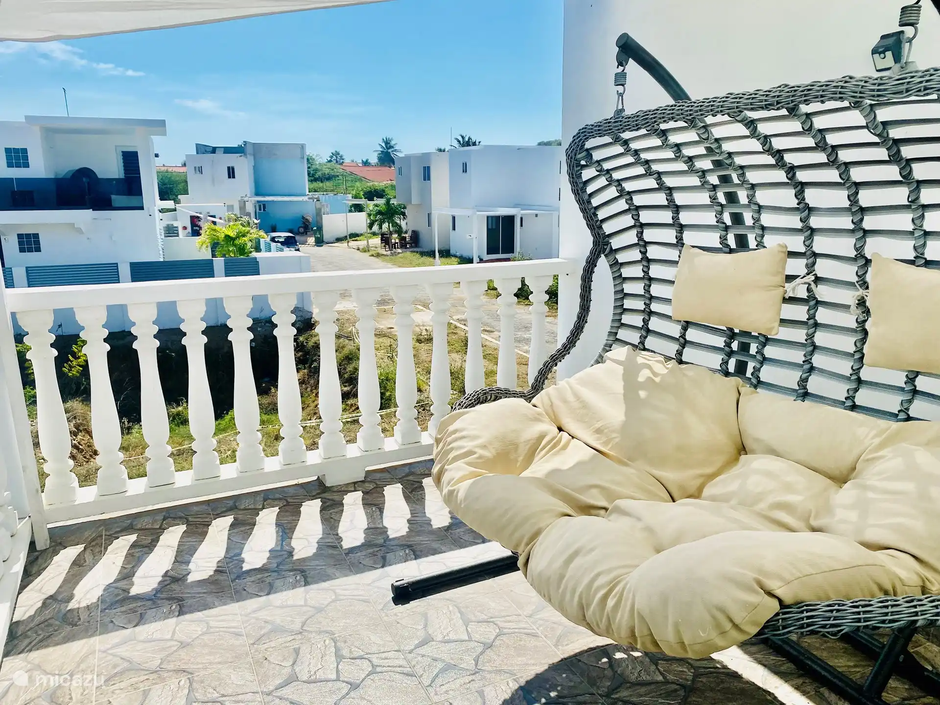 Rocking on the balcony in the rocking chair for 2