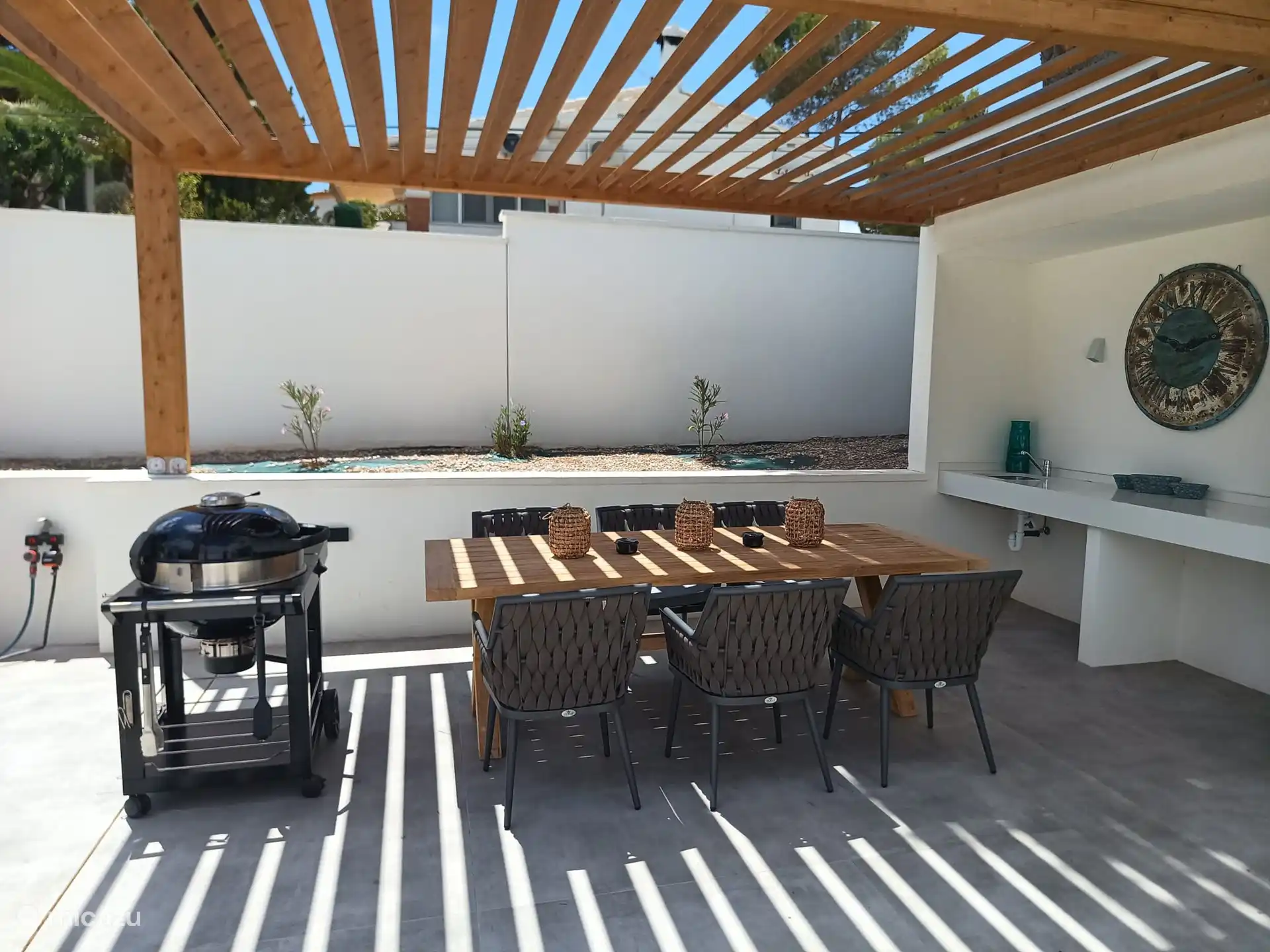 the covered terrace with barbecue