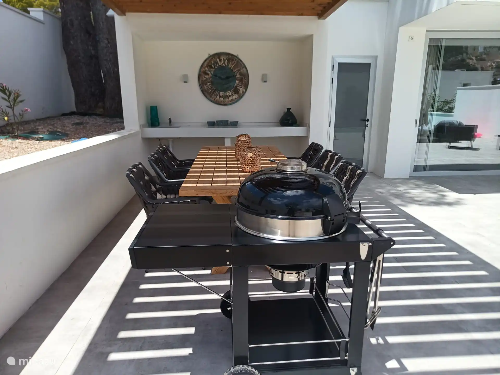 the covered terrace with barbecue