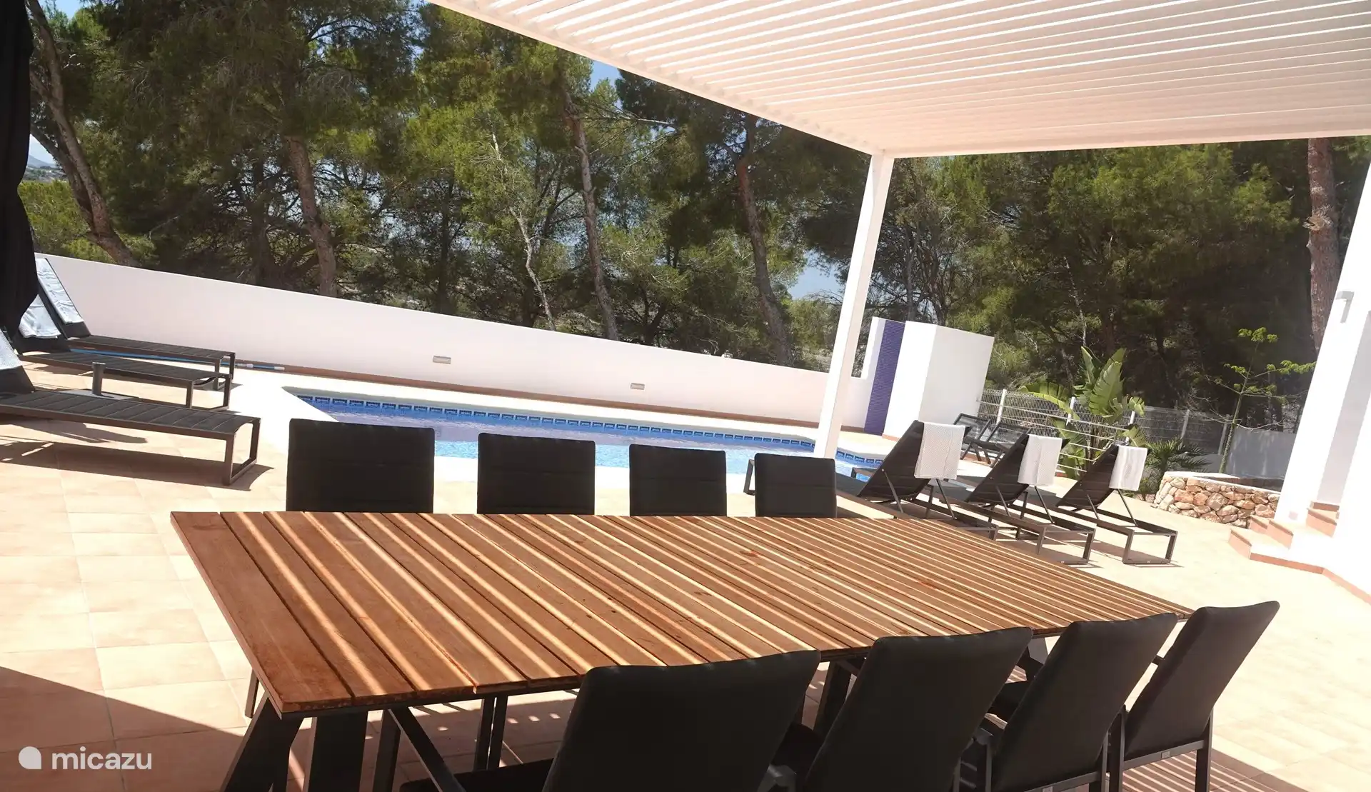 The covered terrace by the pool